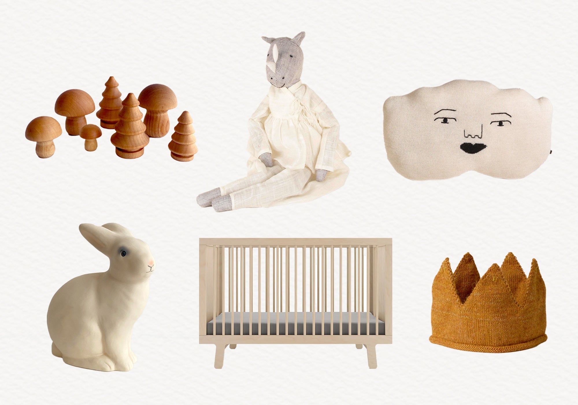 A collection of neutral-toned nursery items: toy trees, plush toys, a crib, and a bunny night light.