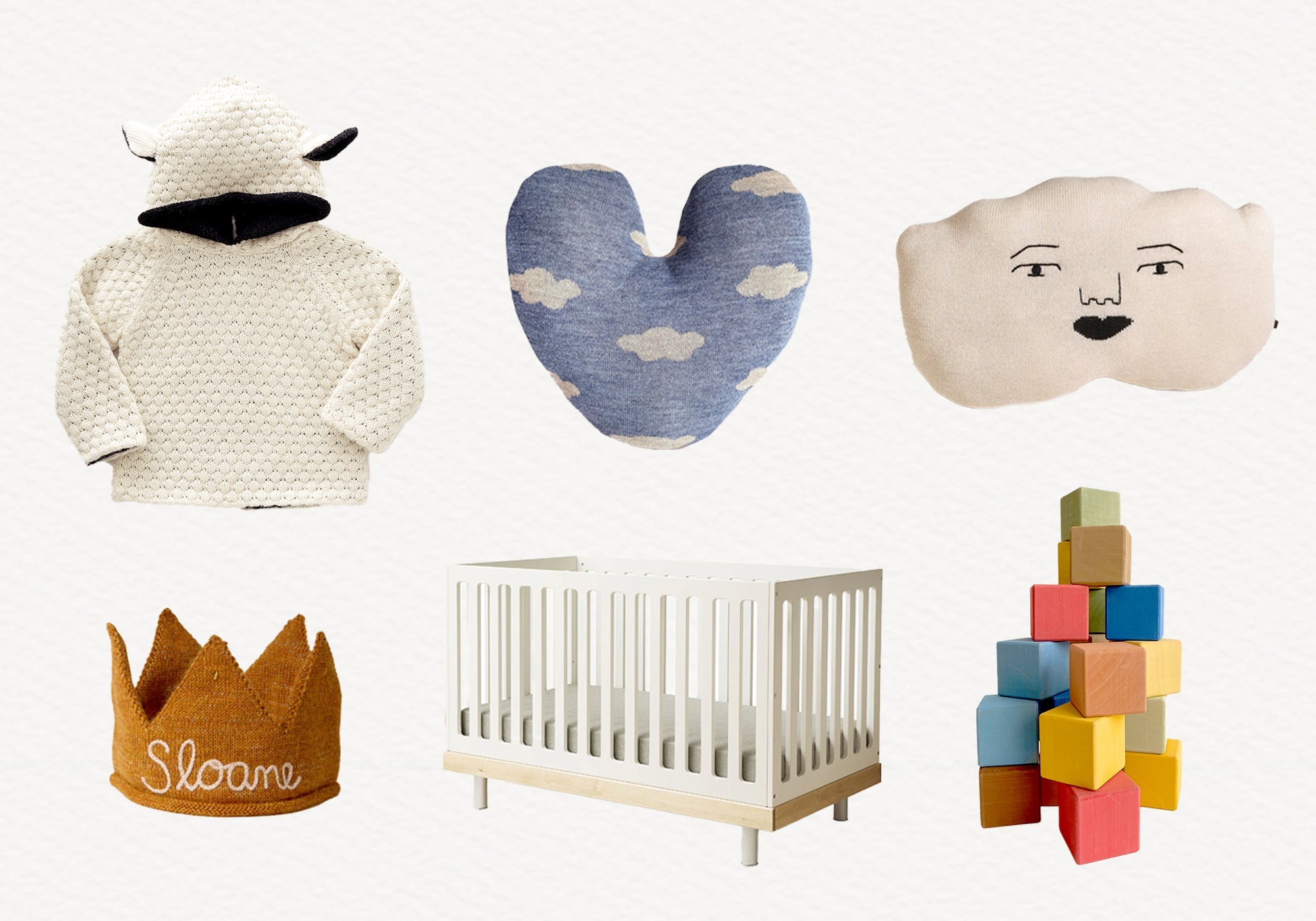 Six baby items: a hooded sweater, two pillows, a crown, a white crib, and colorful building blocks.