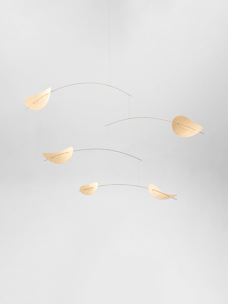 The Drifting Clouds | Nature | Size M mobile features delicate, leaf-shaped wooden pieces suspended against a plain, light grey background.