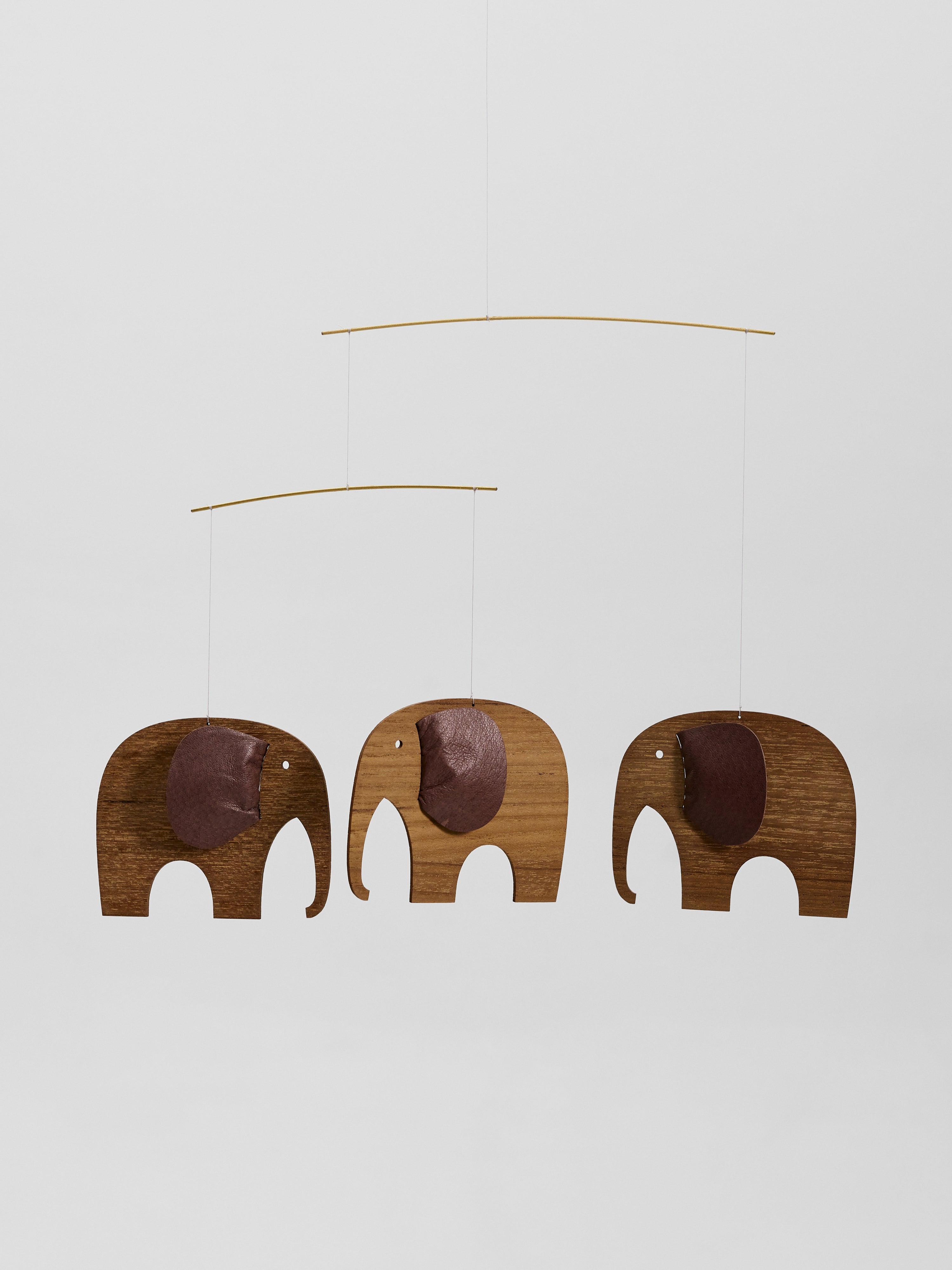 The Baby Elephants 3 | Wood is a wooden mobile featuring three elephant shapes hanging from thin rods against a plain white background.