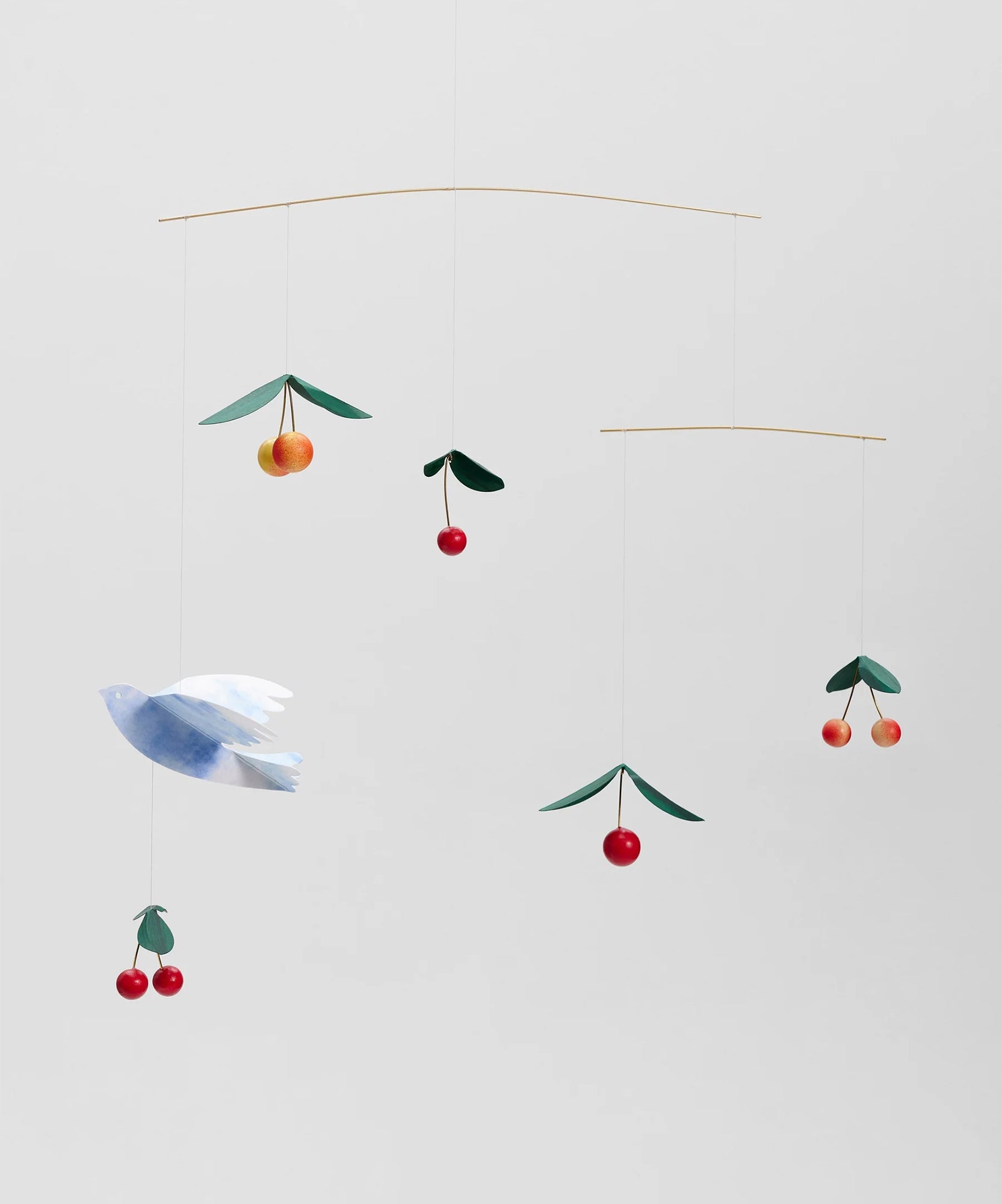 A mobile featuring a Cherry Bird on a neutral background with a blue bird and hanging cherries.