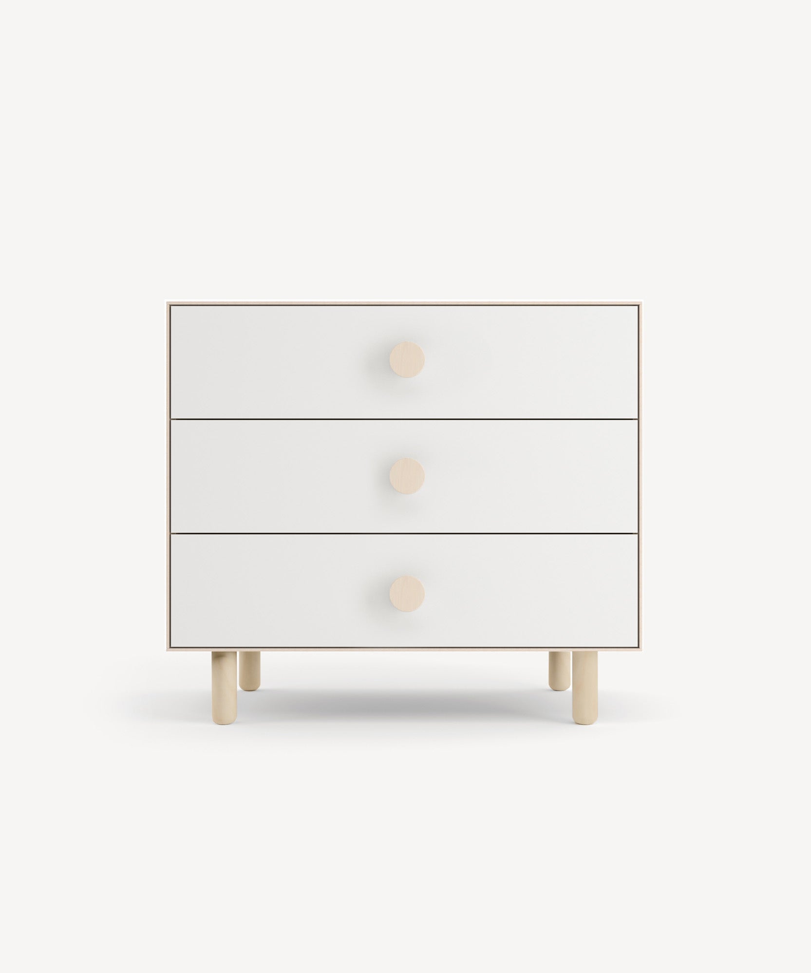 Dot 3-Drawer Dresser in white features a minimalist design with round wooden knobs, set against a plain background.