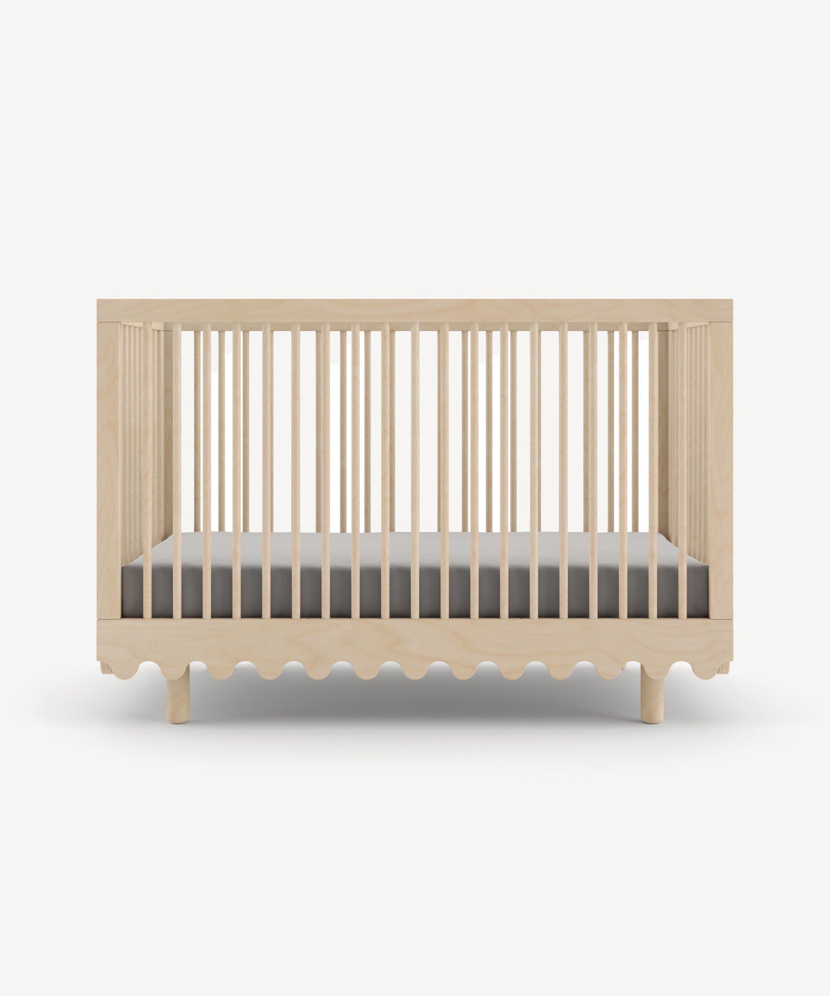 Moss Crib: A natural wood baby crib with slatted sides, a wavy base design, with a gray mattress.