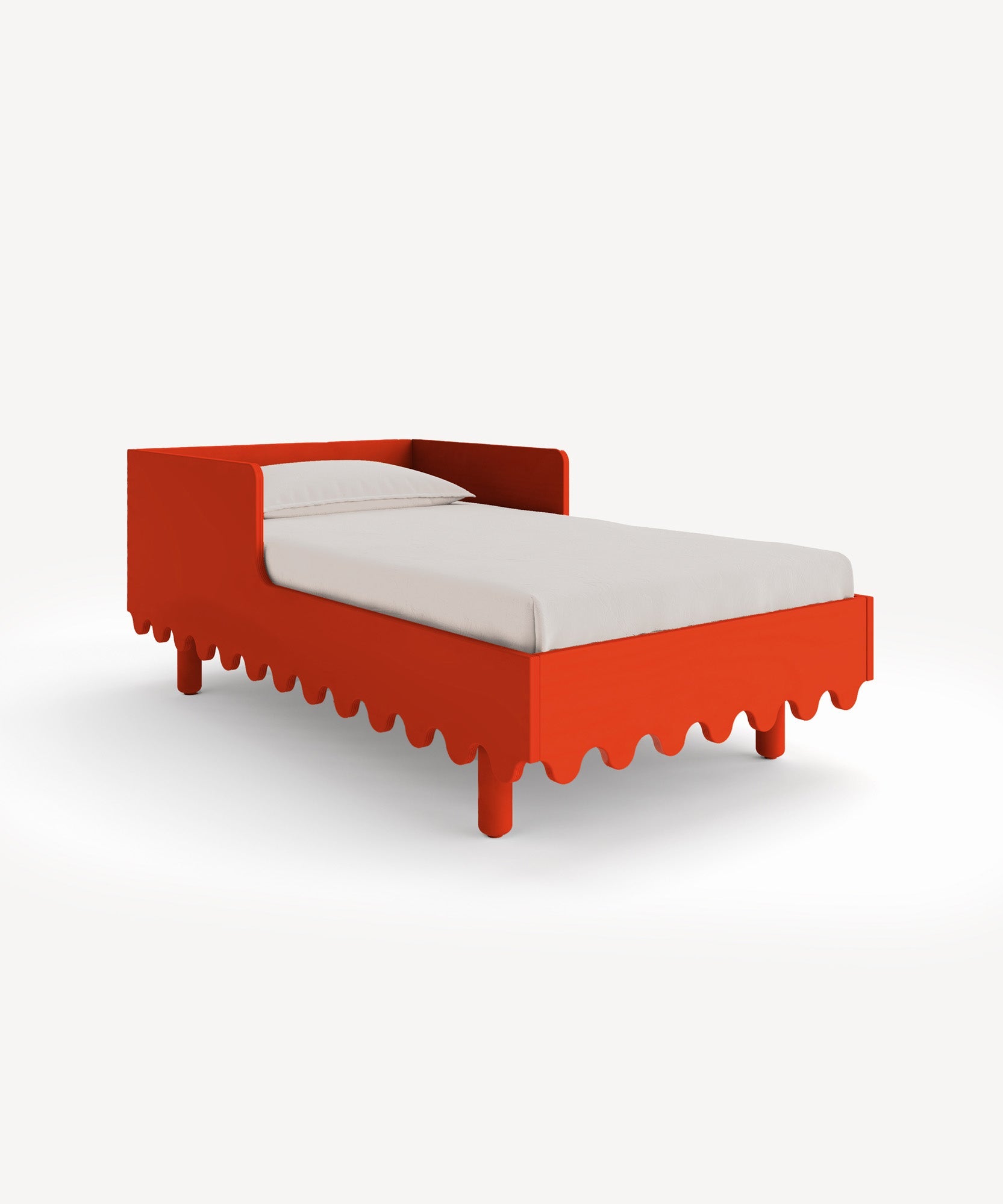The Moss Toddler Bed features a red design with scalloped edges and includes a white mattress, set against a plain background.