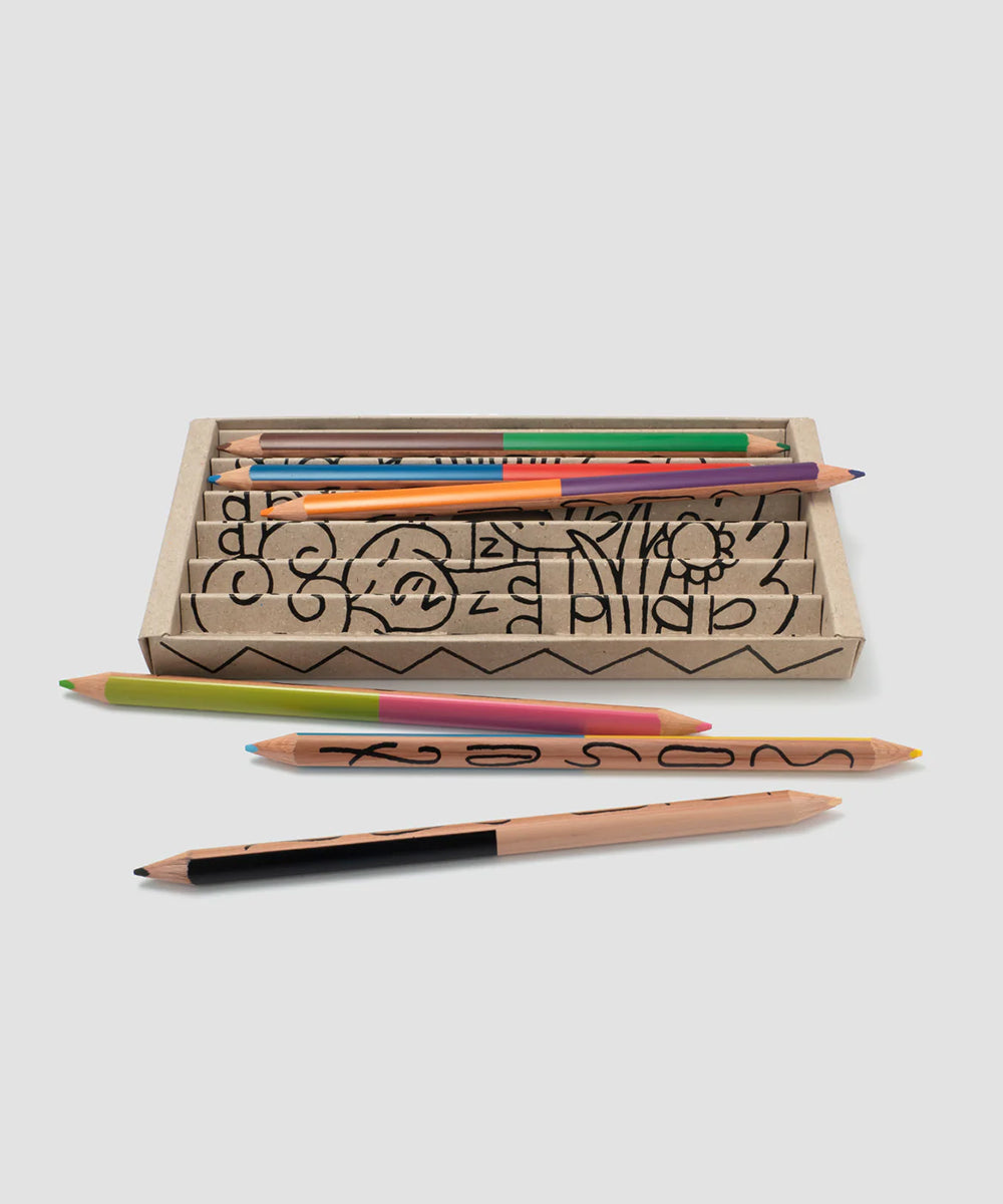 Le Dream Colored Pencils: Set of 6 patterned, colorful pencils shown inside and in front of a cardboard box on a white background.