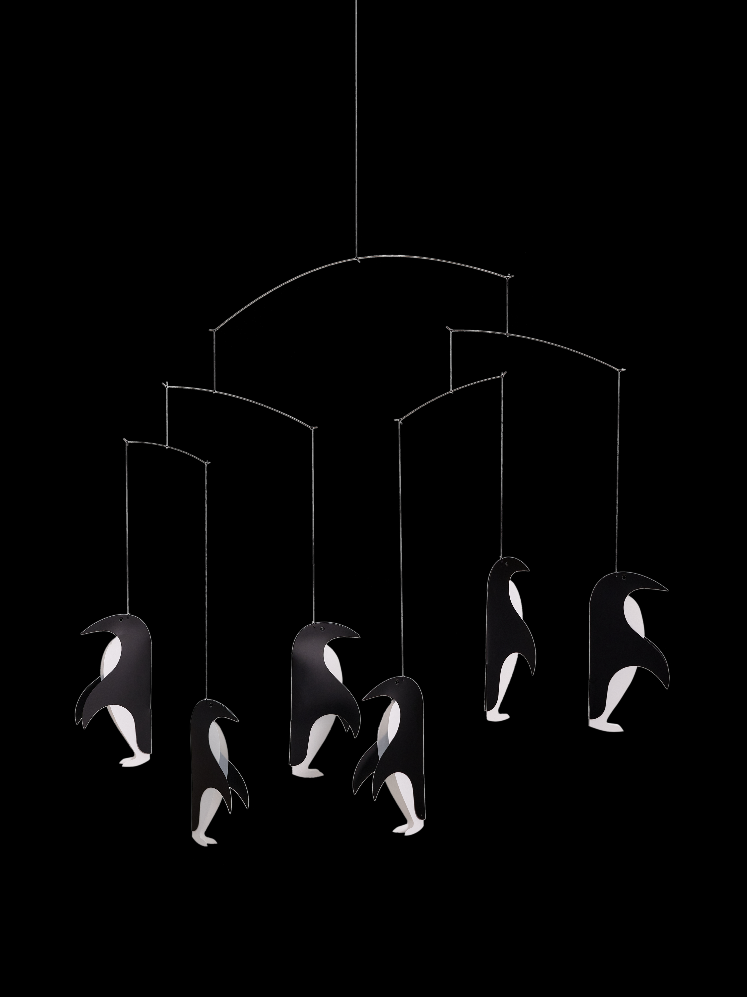 The Penguin Talk mobile features six black and white penguins hanging against a black background.