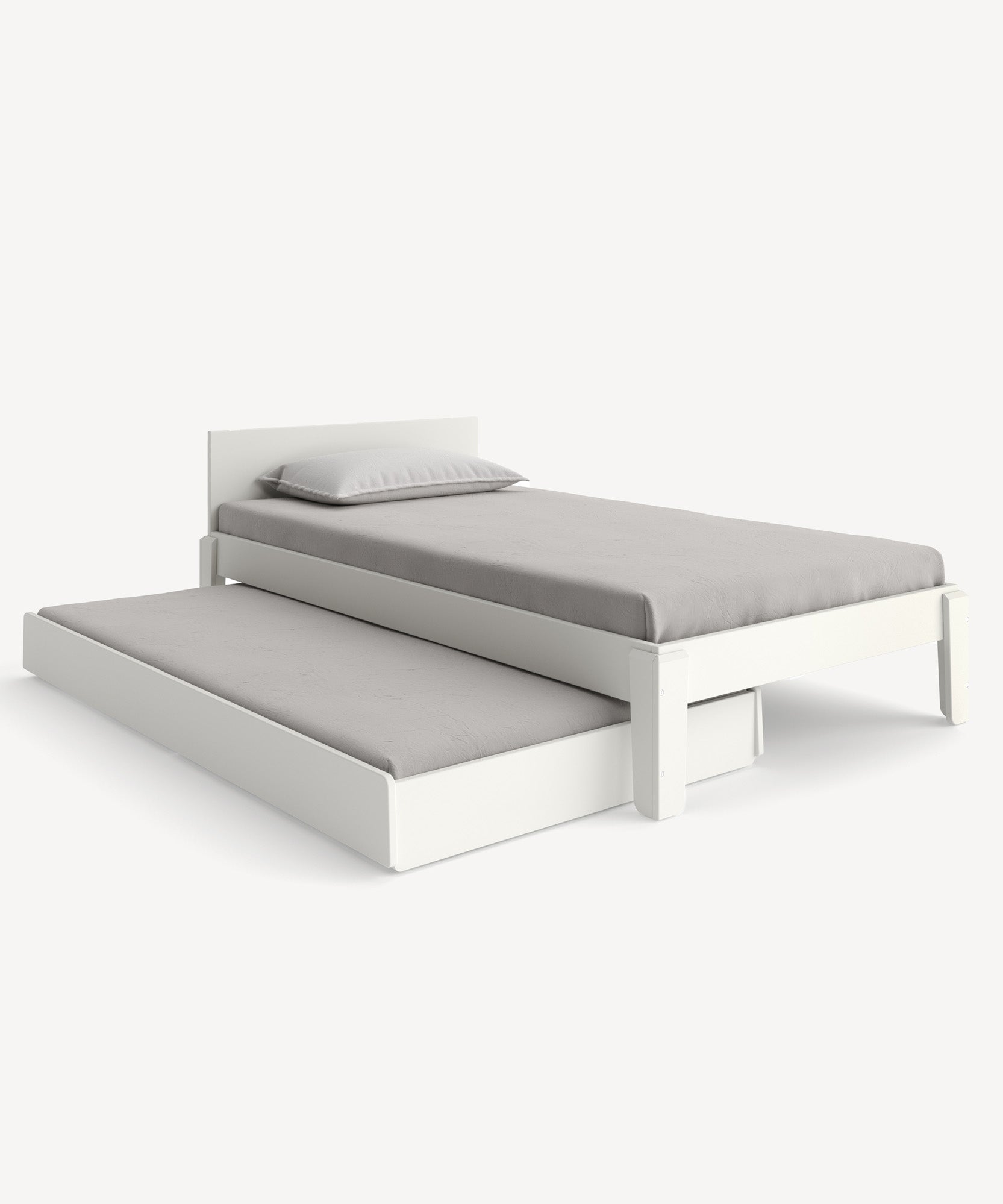 The Perch Trundle Bed & Ladder Conversion Kit, extended with gray bedding and a pillow, sits in a minimalistic room.