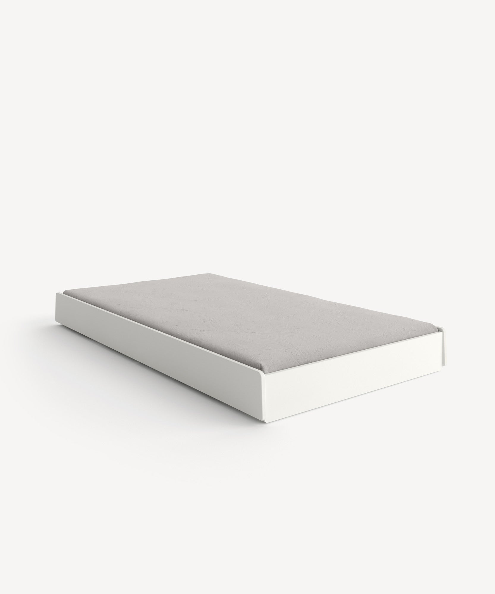 Perch Trundle Bed & Ladder Conversion Kit featuring a minimalist platform with a low white frame and light gray mattress against a white backdrop.