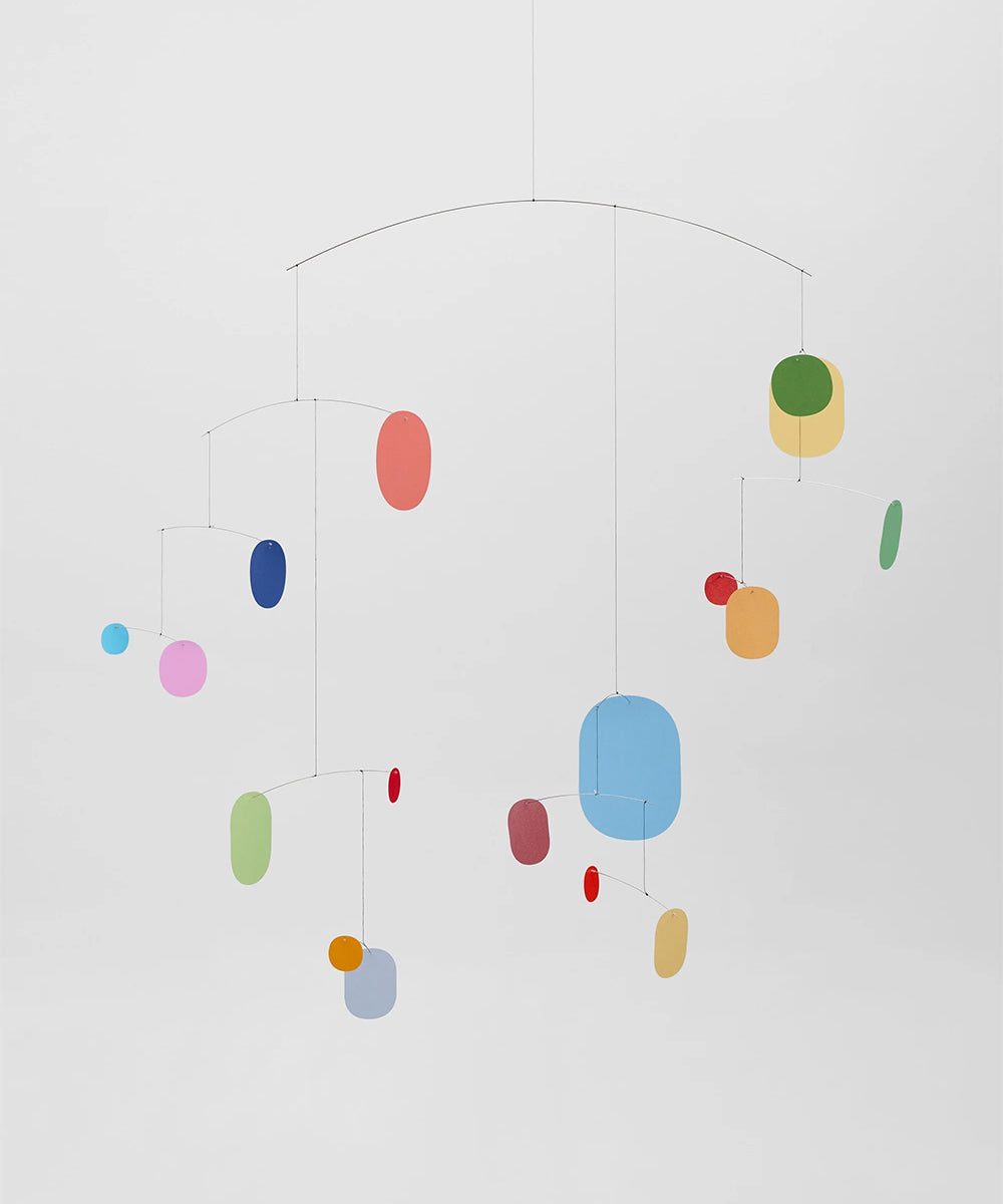 Colorful mobile with hanging circles on a white background
