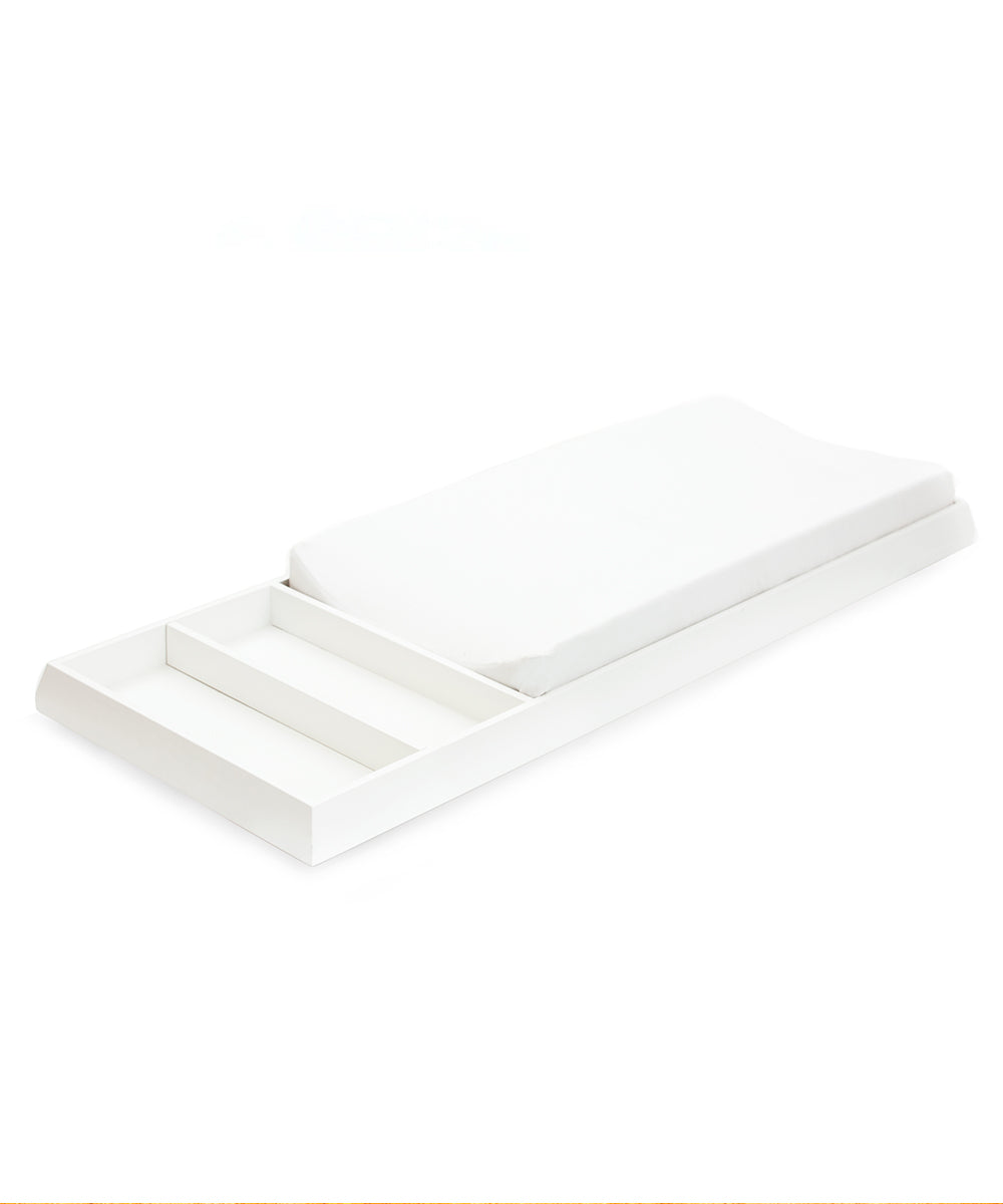 White changing station with a padded surface and additional compartments on the side, set against a white background.