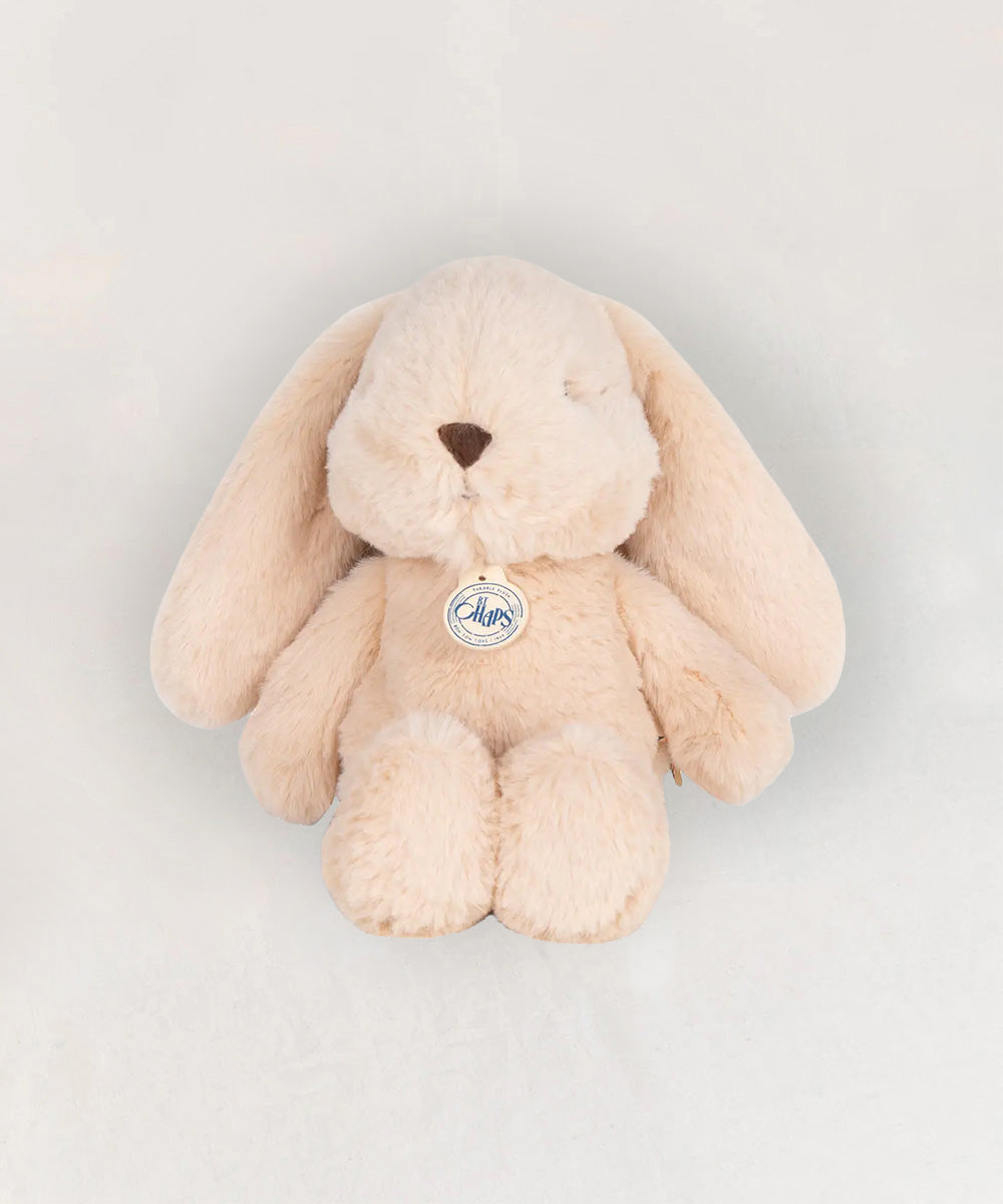 Bubbles le Bunny: a plush beige bunny toy with long floppy ears and a round nose, shown on a plain light background.