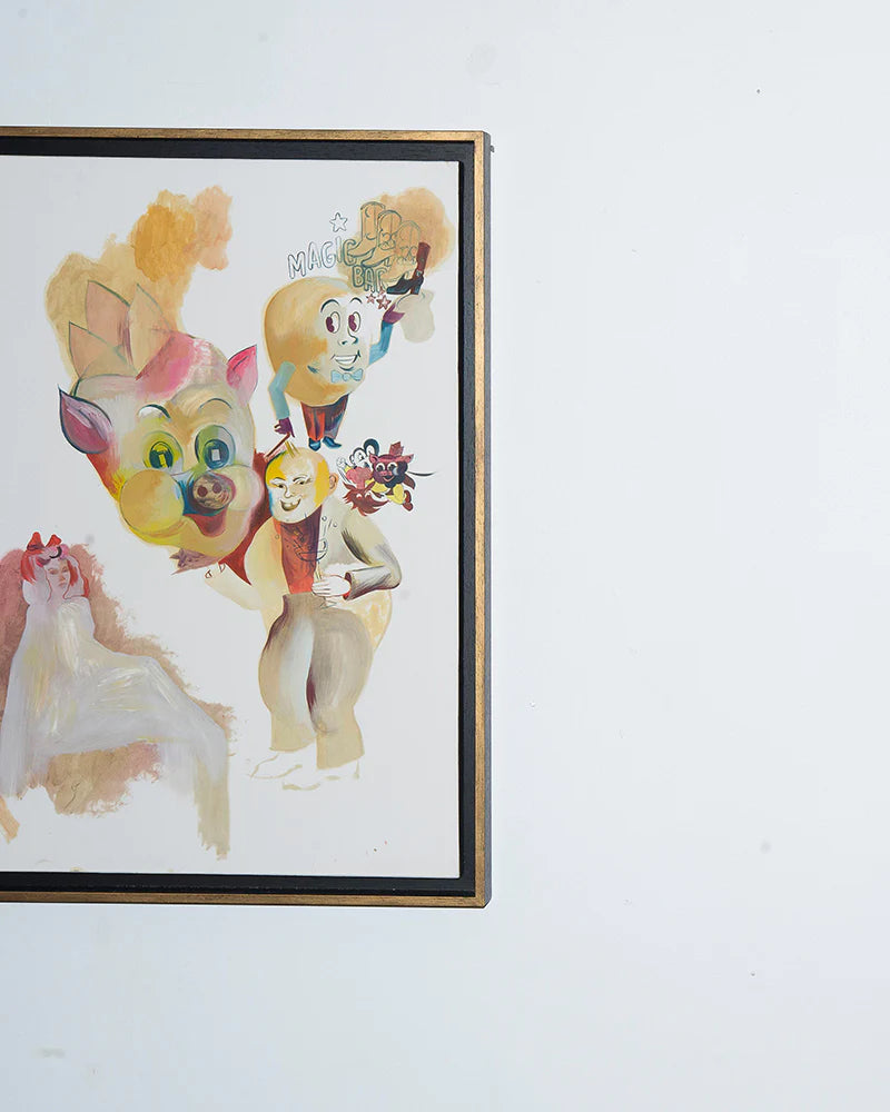 Framed abstract art on a white wall featuring colorful, cartoonish faces and figures with exaggerated expressions.