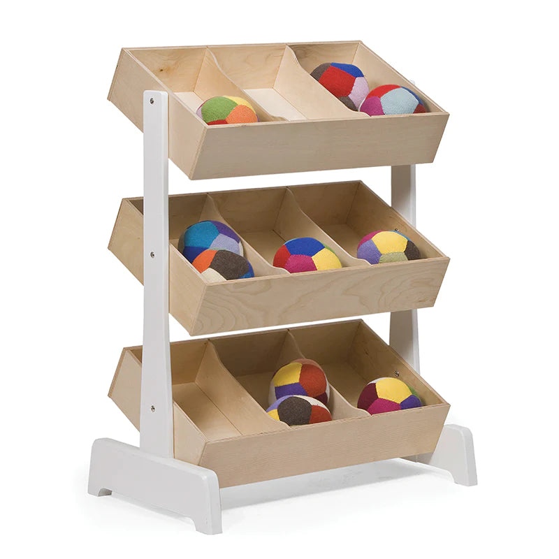Wooden display rack with three tiers, each holding brightly colored fabric balls in compartments.