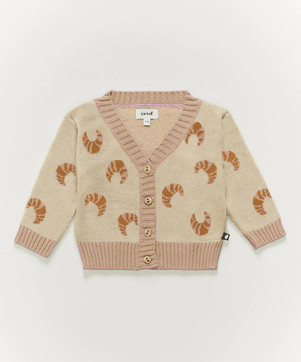 Beige childrens cardigan with front buttons and shrimp pattern.