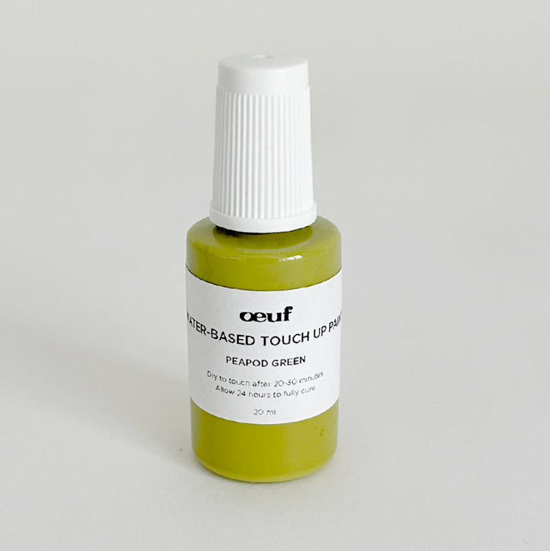 Peapod green touch-up paint in a small bottle set against a white background.