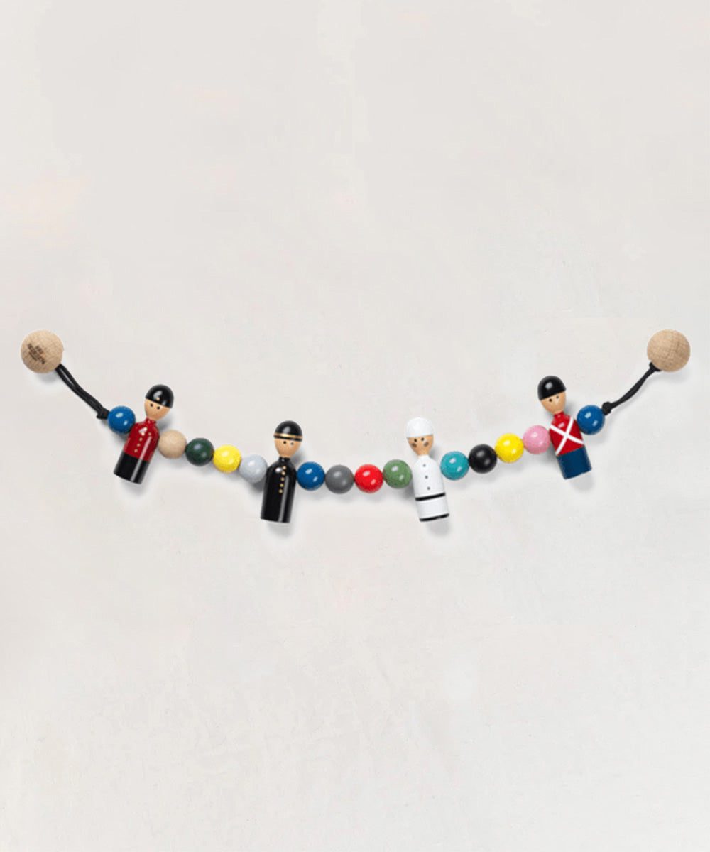 Le Pram Chain stroller toy featuring a string of colorful wooden beads and four wooden figures dressed as guards or officers.