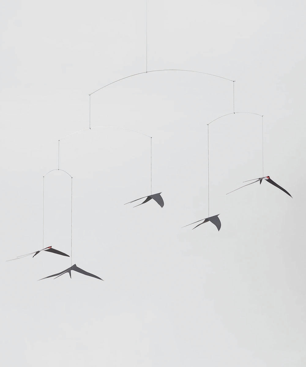Le Mobile - Flying Swallows 5: Minimalist black mobile featuring five swallow shapes suspended by thin wires for an elegant display.