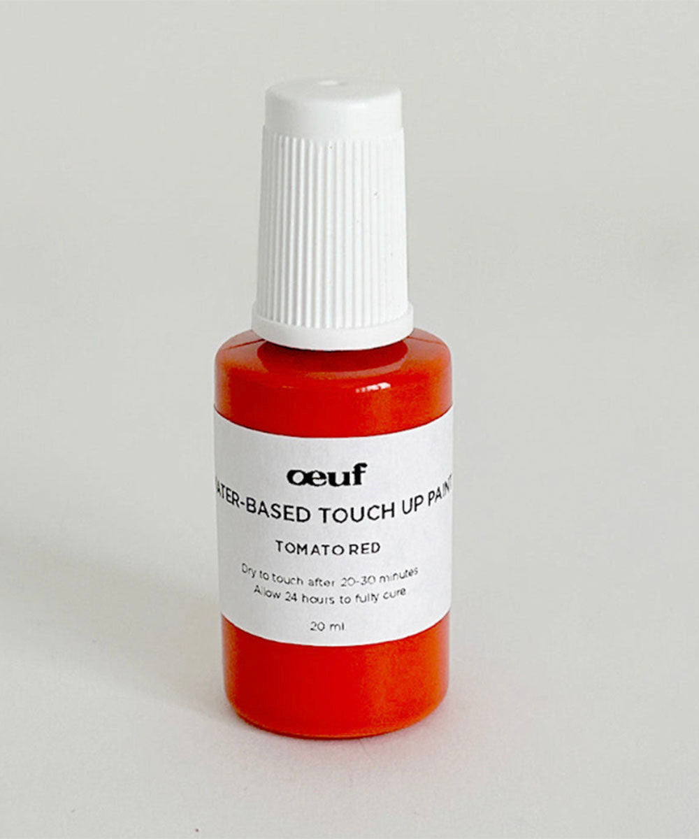 Oeuf Touch-up Paint in tomato red, small bottle, water-based, with a white screw cap.