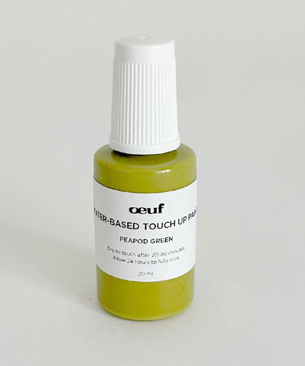 A small bottle of Touch-up Paint in peapod green, water-based, with a white cap and label.