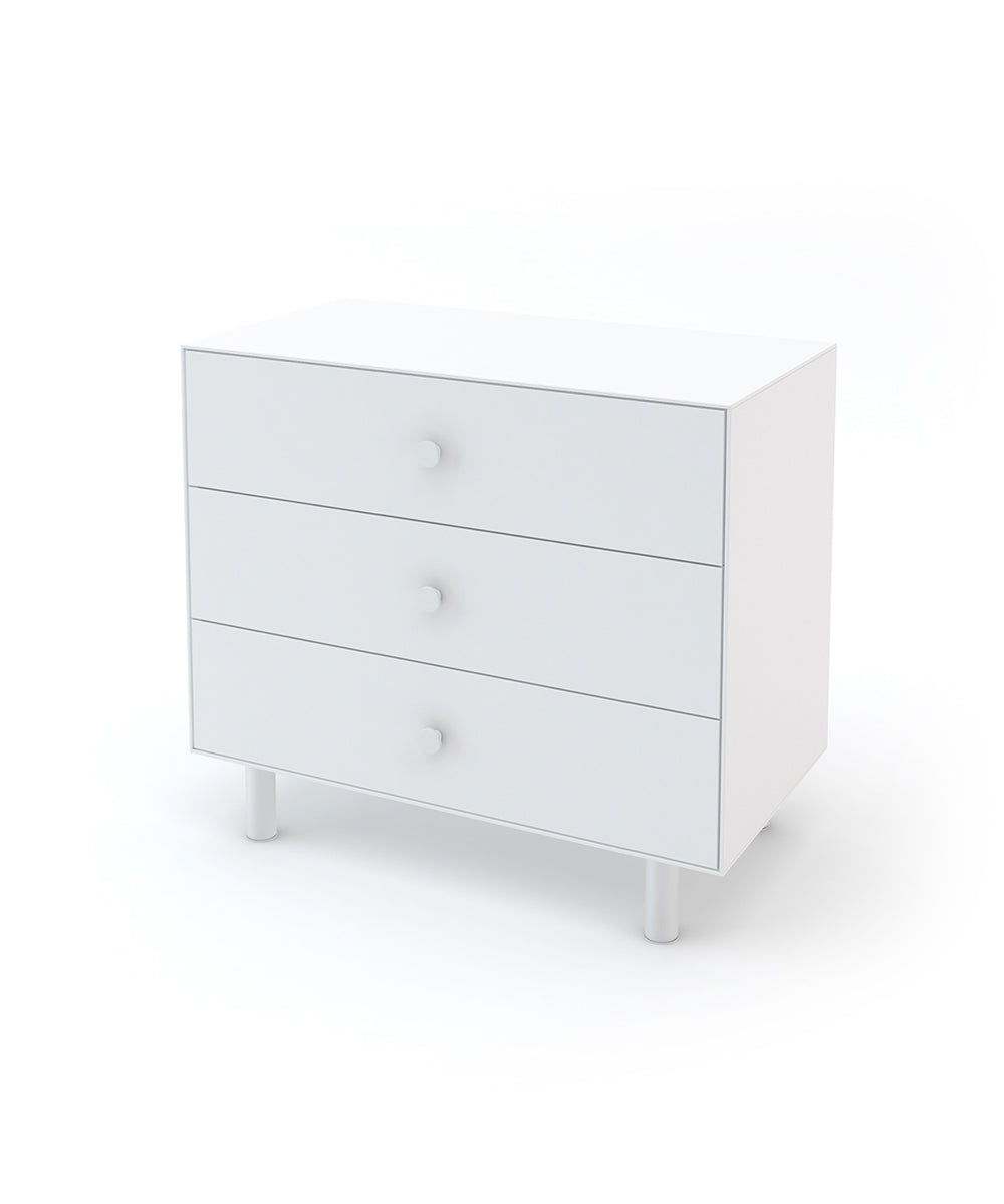 All-white dresser with three drawers, metal knobs and legs.