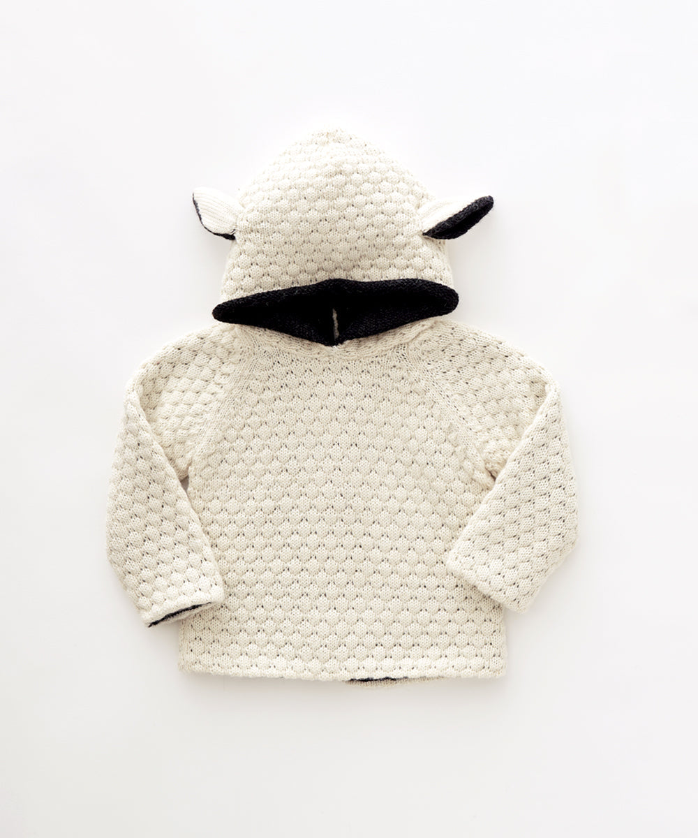 Sheep Hoodie: a cream-colored, textured hoodie with animal ears and black inner hood, displayed flat on a white background.