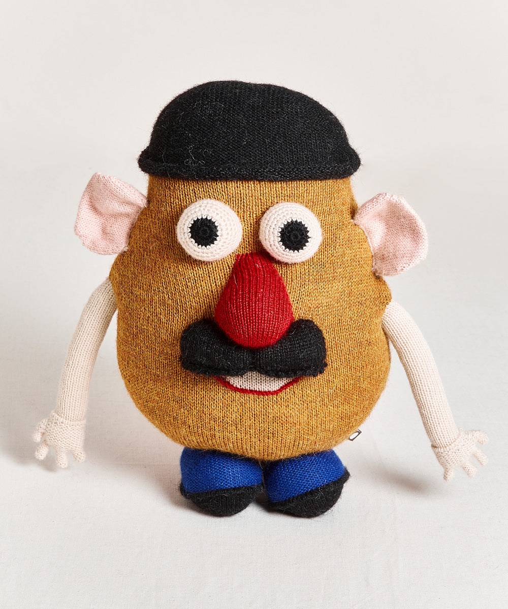 Funny Face Pillow plush toy featuring a potato shape with a black hat, large eyes, red nose, mustache, and detachable limbs on a plain background.