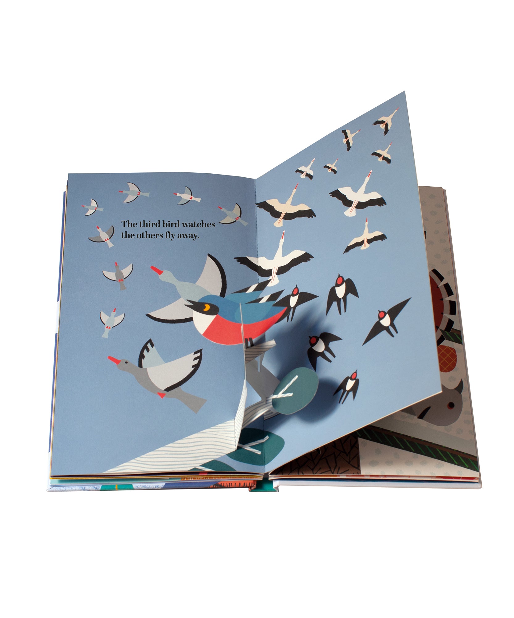 Open "Le Book - Six Little Birds," a pop-up book with birds soaring in the sky, featuring text on the third bird observing others as they fly away.