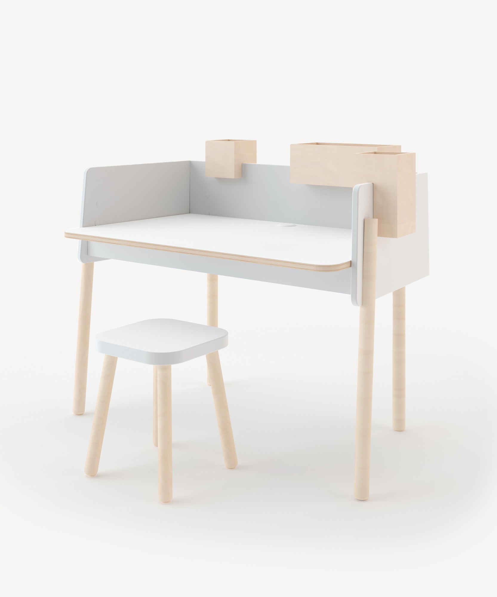 The Brooklyn Desk is a minimalist wooden desk with a stool, wraparound backboard, and natural wood legs.