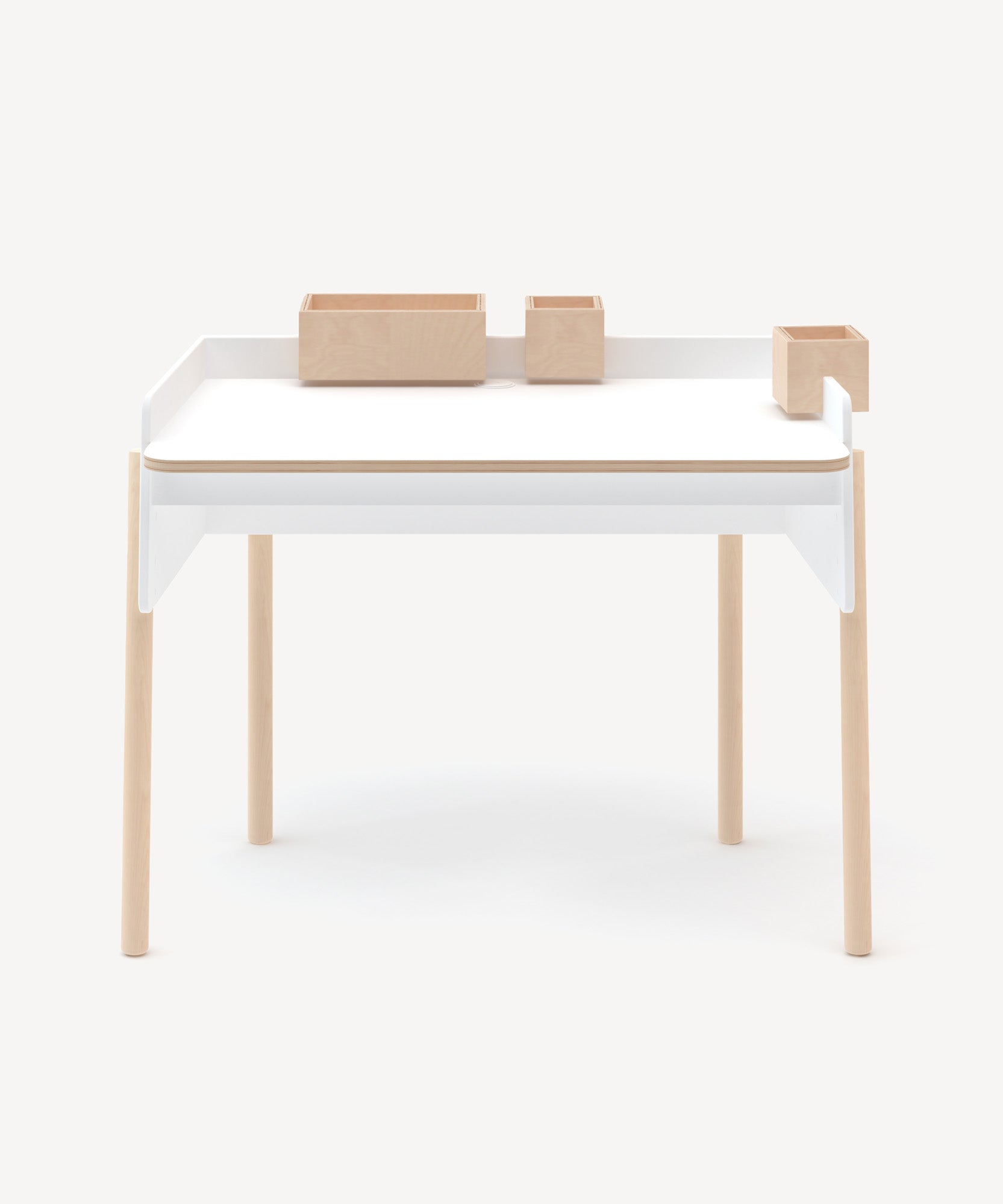 The Brooklyn Desk is a minimalist wooden desk featuring white accents and attached storage compartments, set against a white background.