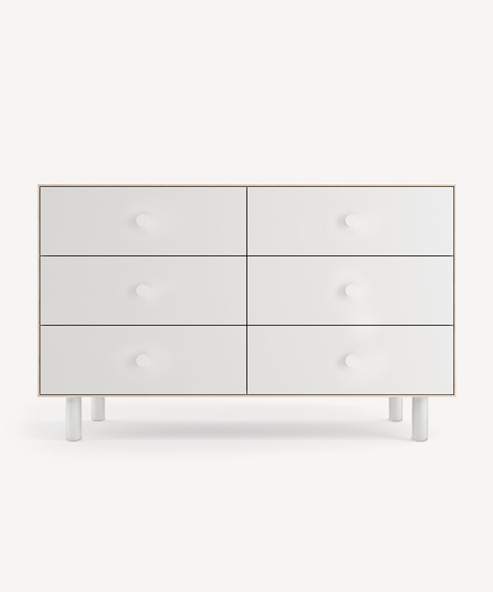 Classic 6-Drawer Dresser in white features a minimalist design with round knobs on a light backdrop.