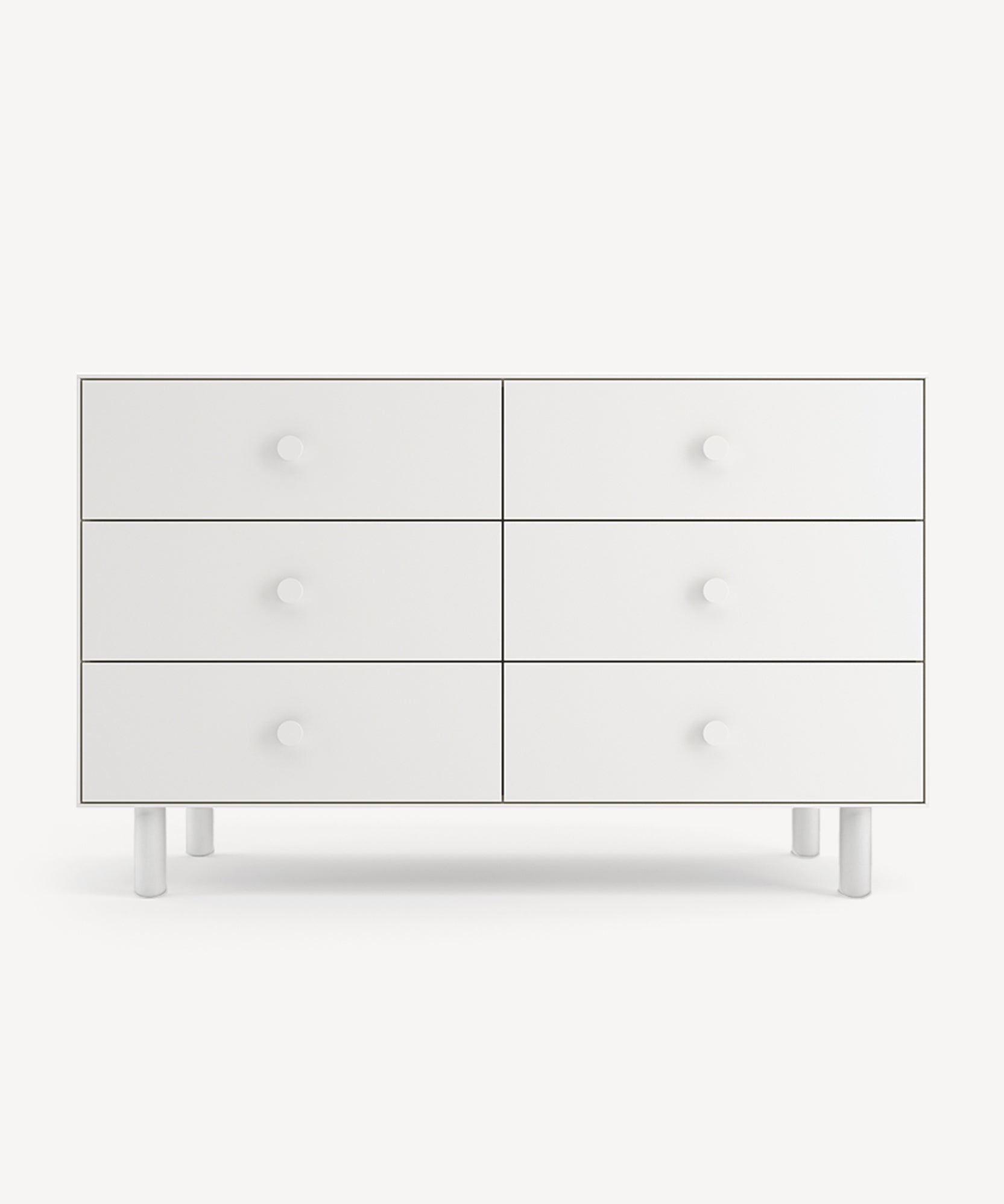 A Classic 6-Drawer Dresser in white with round knobs and short legs.