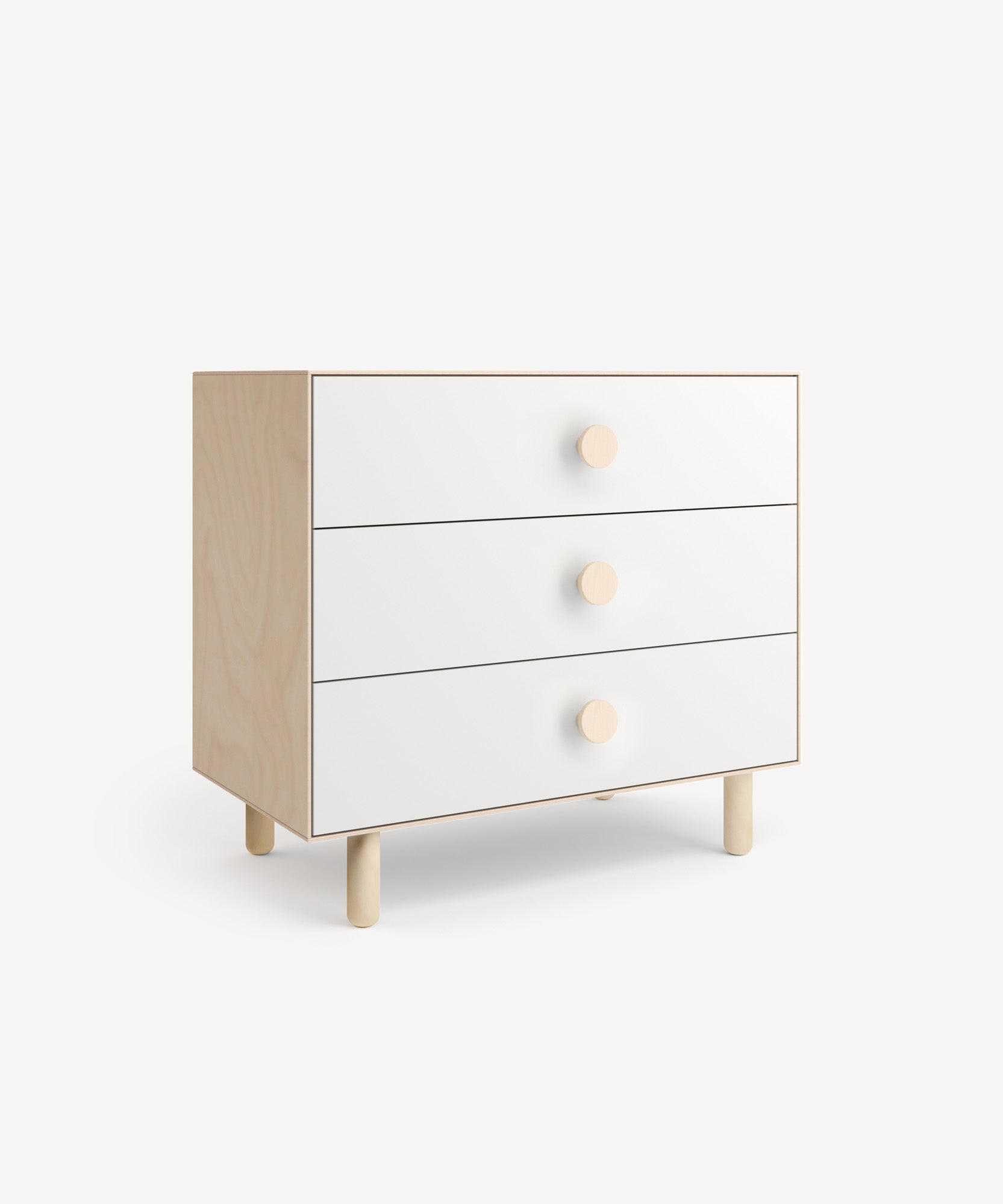 The Dot 3-Drawer Dresser is a minimalist wooden piece featuring three white drawers with circular knobs, set against a light background.