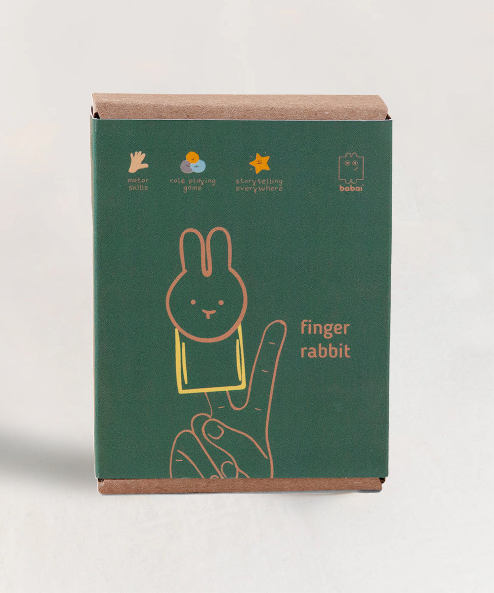 A green box labeled Le Rabbit Finger Puppet features an illustration of a bunny puppet on fingers, highlighting its benefits for motor skills, role-playing, and storytelling.