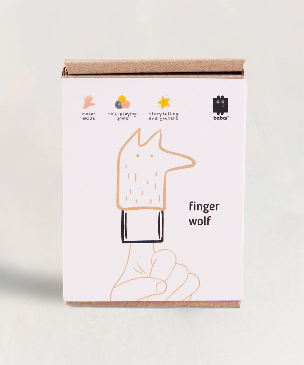 Box featuring an illustration of the Le Wolf Finger Puppet, accompanied by text finger wolf and icons representing motor skills, role playing, and storytelling.