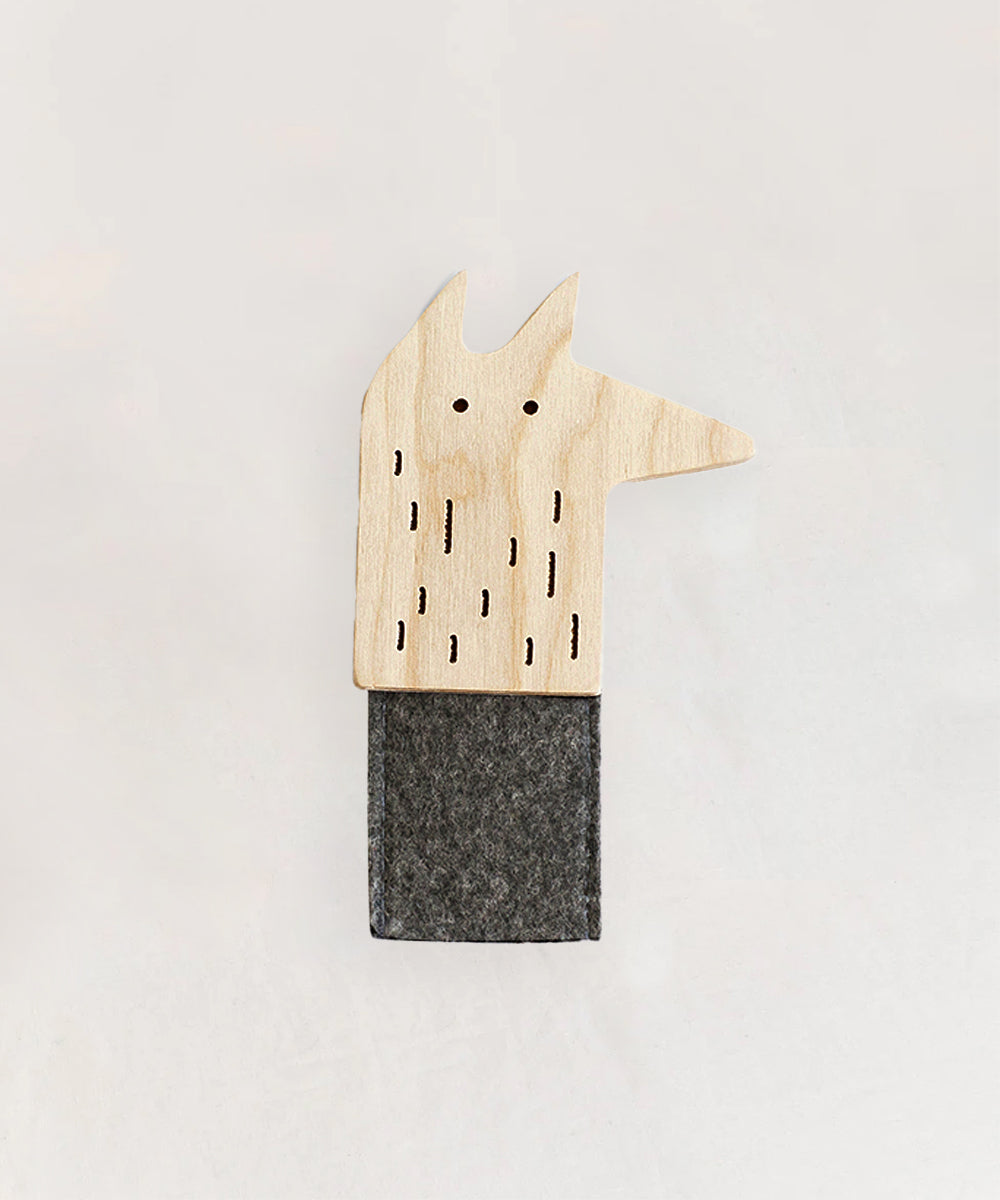 The Le Wolf Finger Puppet, a wooden fox-shaped card holder with cut-out details, features a gray felt sleeve as its lower section and is showcased on a plain background.