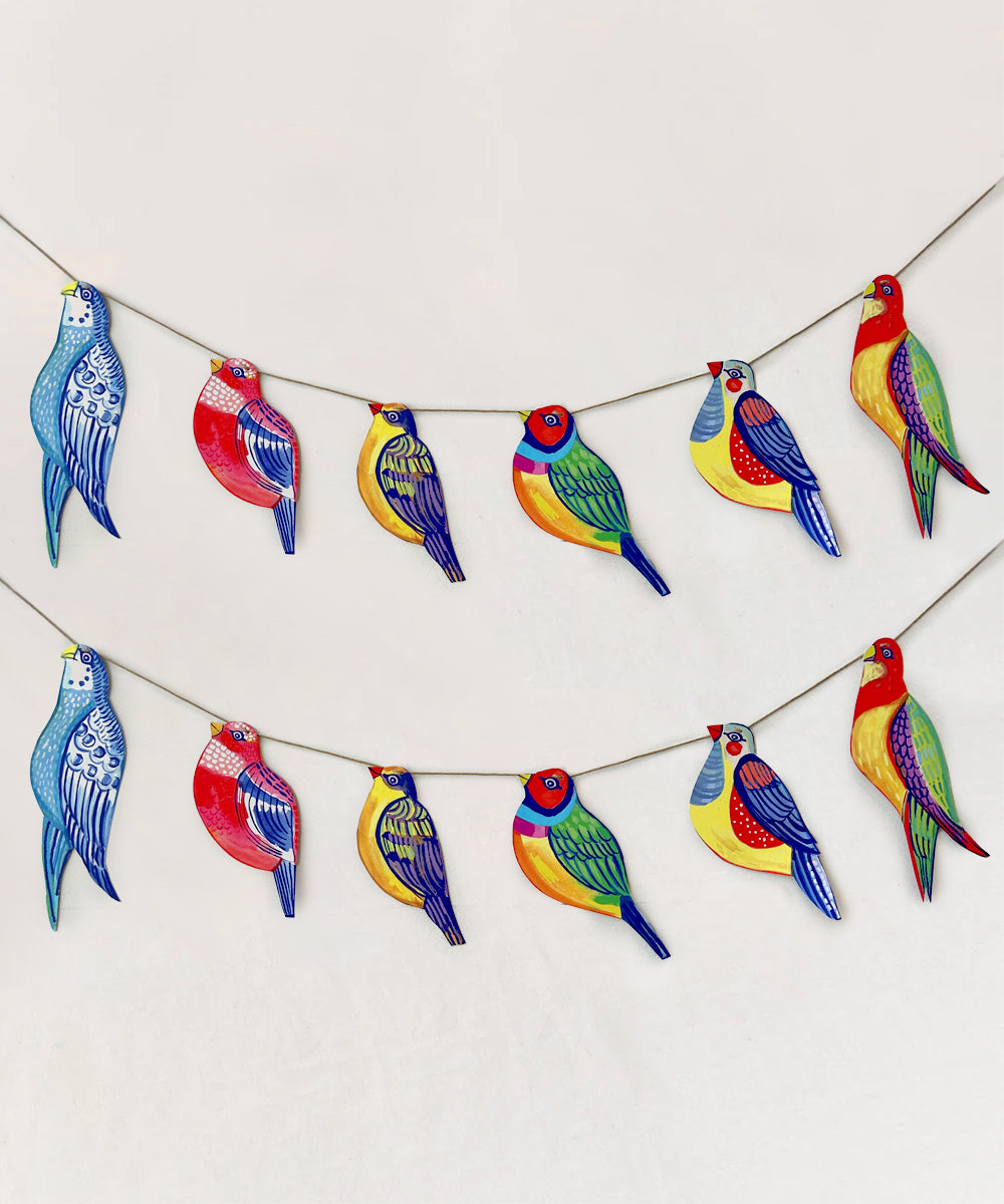 The Le Garland - Colorful Birds features a collection of vibrant bird ornaments hanging on two strings set against a plain background.