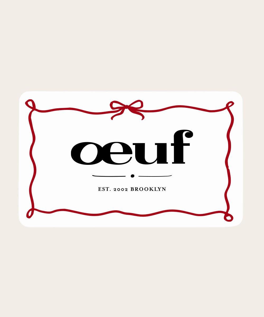 A white Gift Card with "oeuf" and "EST. 2002 BROOKLYN," framed by a red ribbon-like border.
