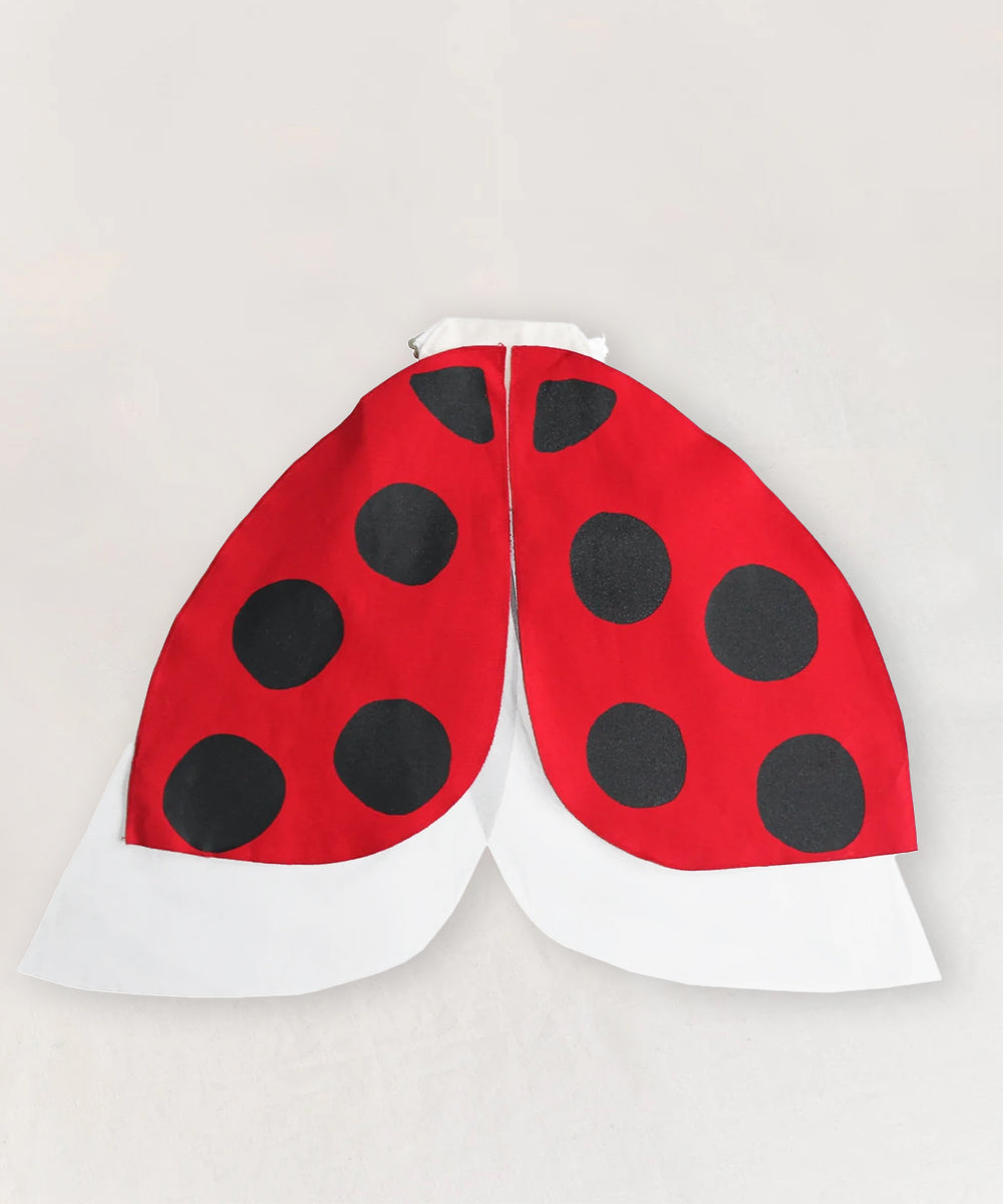 Le Ladybug Wings Costume features red and black wings with black spots and white lower edges, shown on a light background.