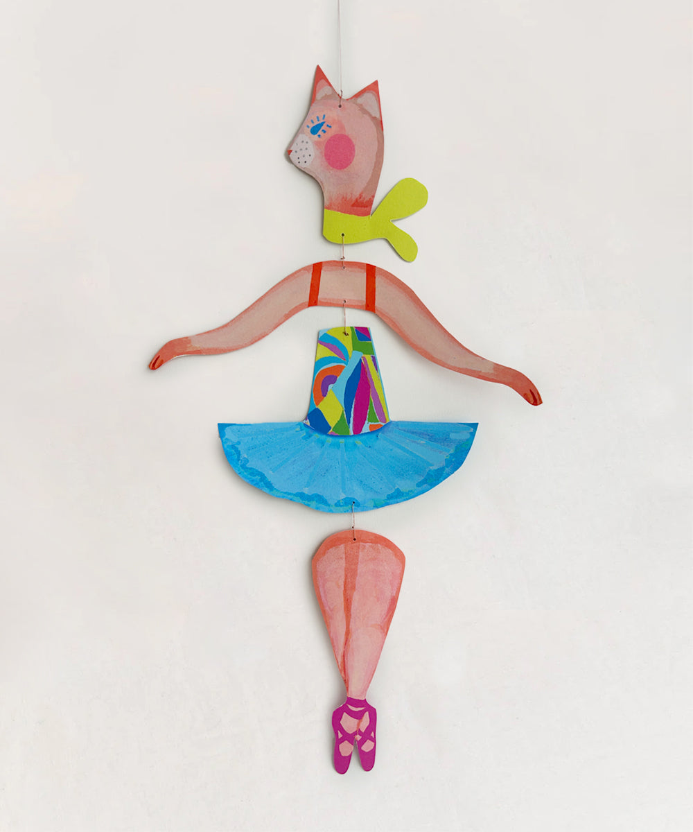 The Le Mobile - Cat Ballerina is a vibrant paper puppet featuring a pink-faced cat adorned with a blue skirt and ballet shoes, set against a plain background.