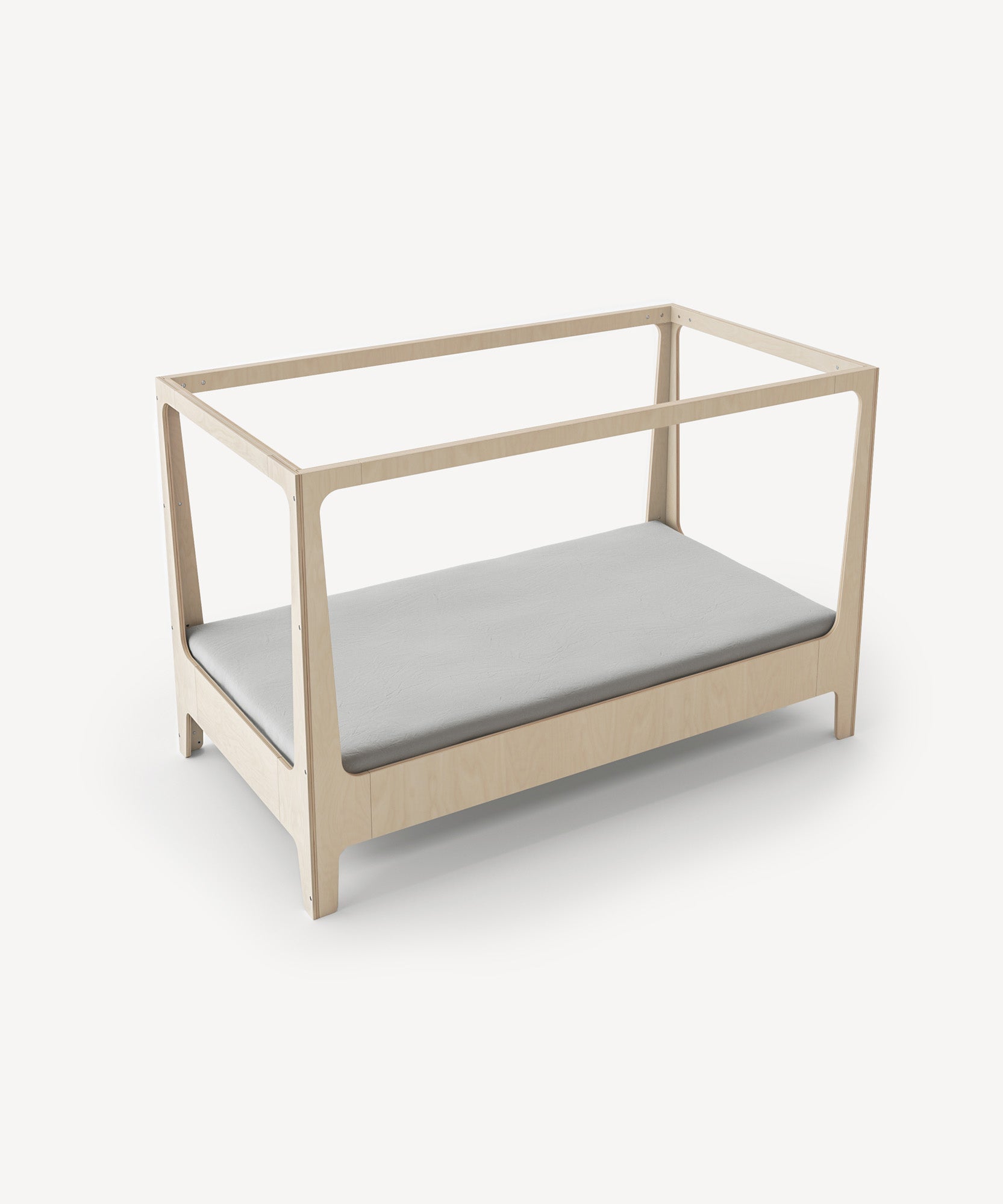 The Perch Nest Bed is a wooden toddler bed frame with a simple design, featuring a gray mattress and no side railings.