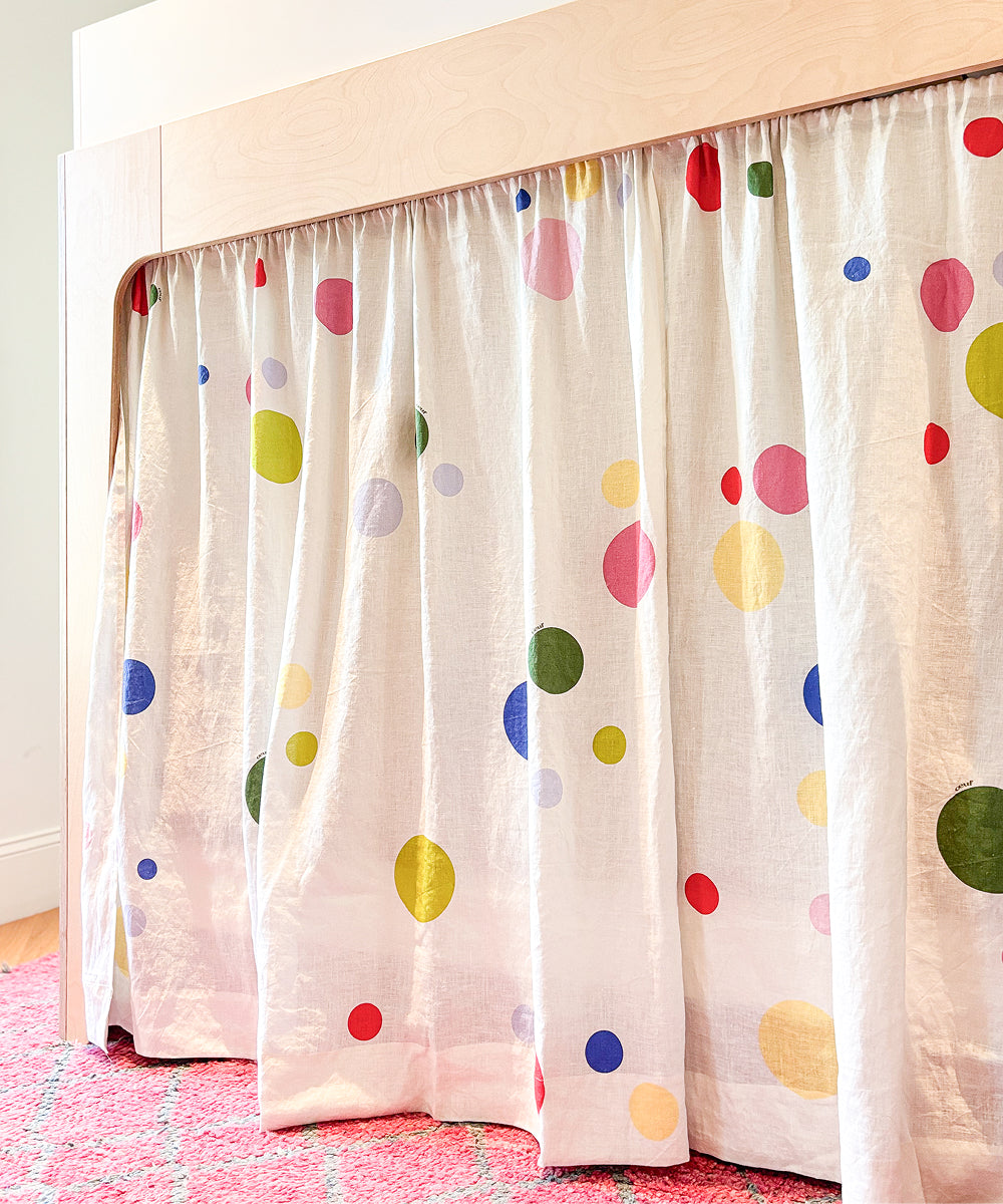 Printed Perch Bunk/Loft Linen Curtains featuring a colorful polka dot pattern hanging from a wooden loft bed frame.