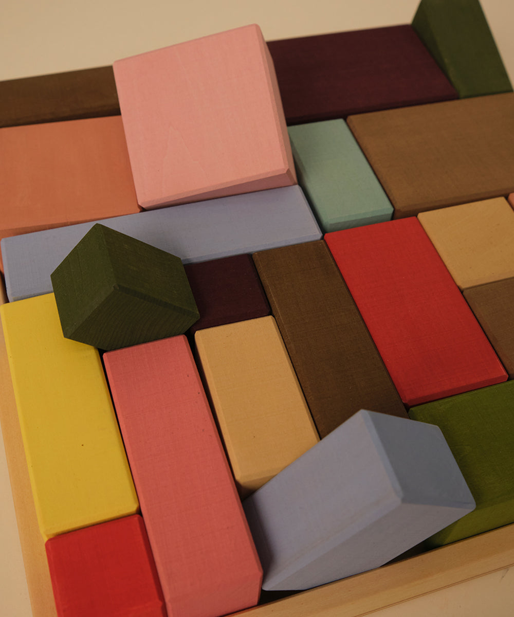 Colorful wooden blocks on a wooden surface
