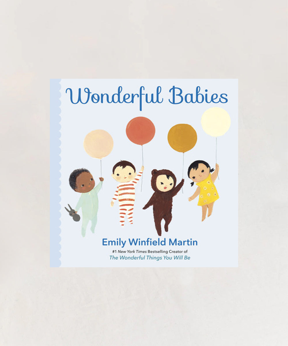 The cover of Le Book - Wonderful Babies features four babies, one in a bear suit, each holding a colorful balloon.