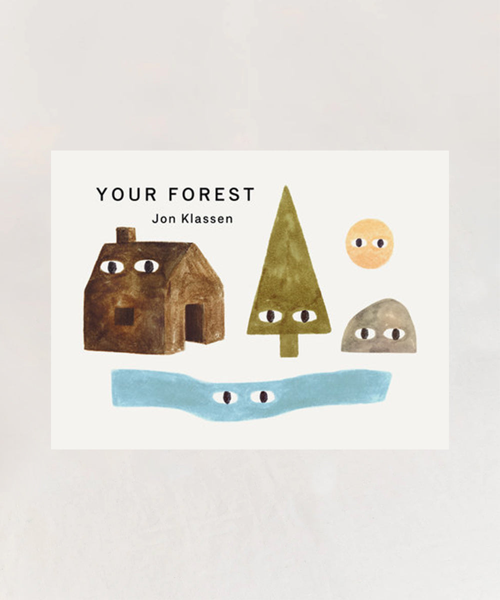 Book cover for "Le Book - Your Forest" features a house, tree, rock, sun, and river—all with eyes—by Jon Klassen.