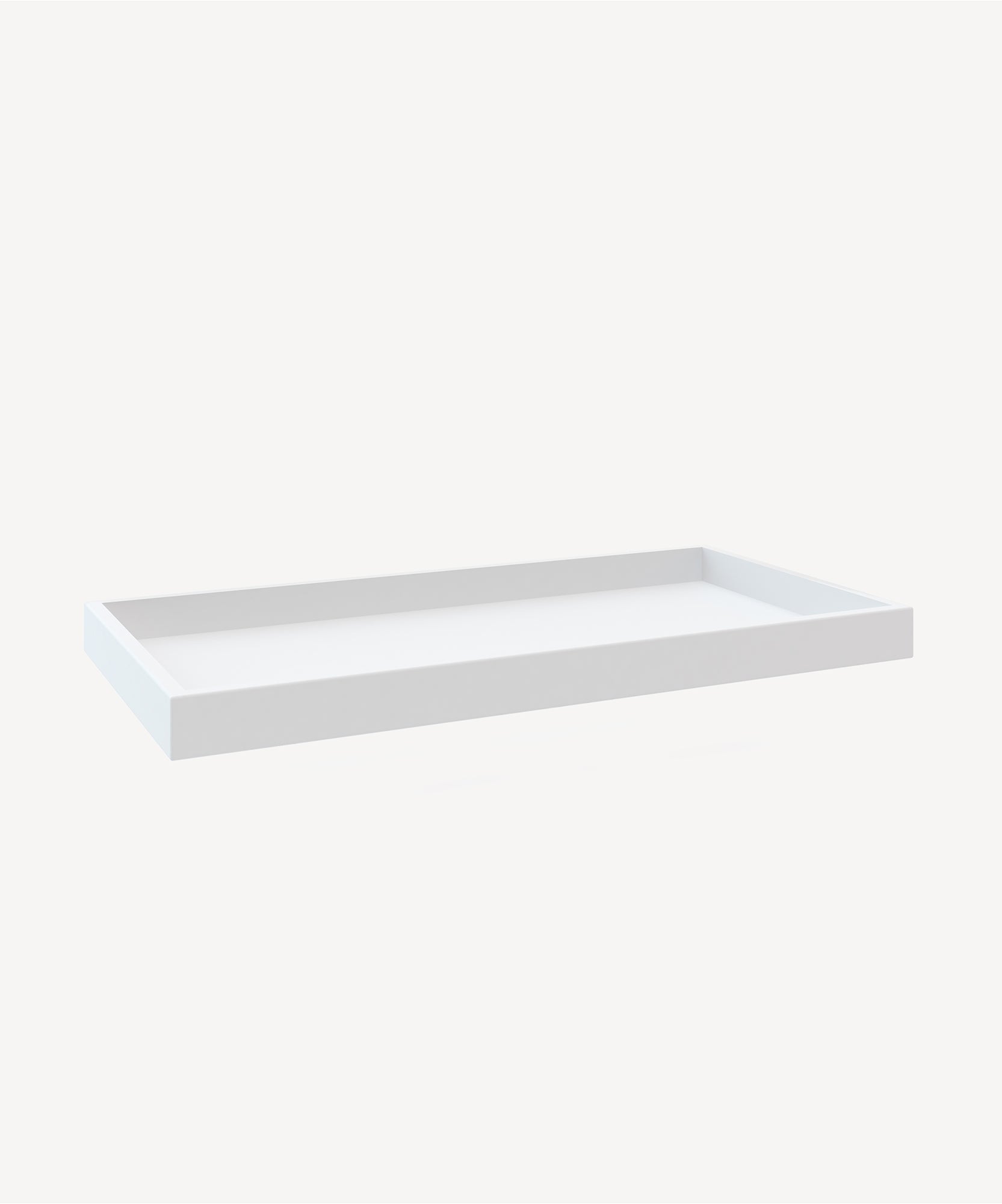 A Changing Tray in white, rectangular with raised edges, on a light background.