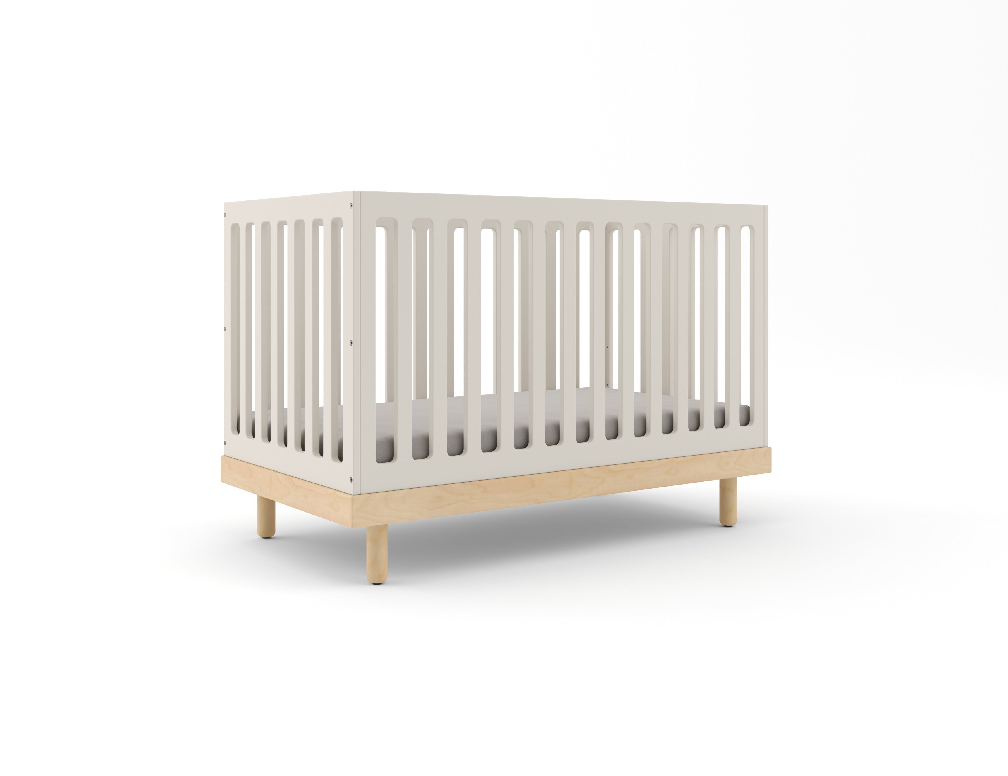 A Classic Crib in a modern design featuring a white finish with wooden accents on a white background.