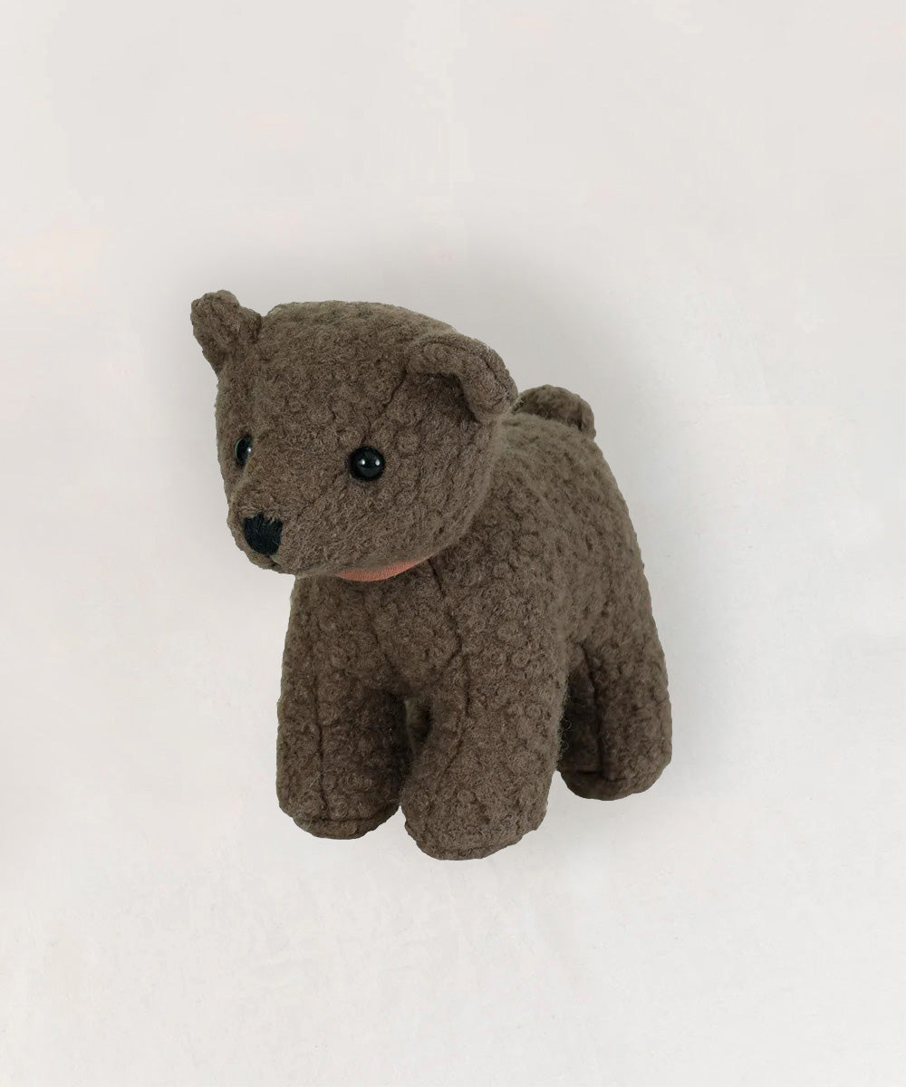 Raoul le Bear is a small, brown plush teddy bear with black button eyes, displayed on a plain white background.