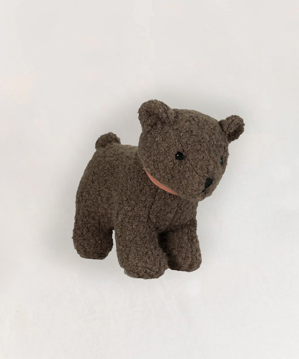 Raoul le Bear, a simply designed brown plush toy, stands on a plain white background.