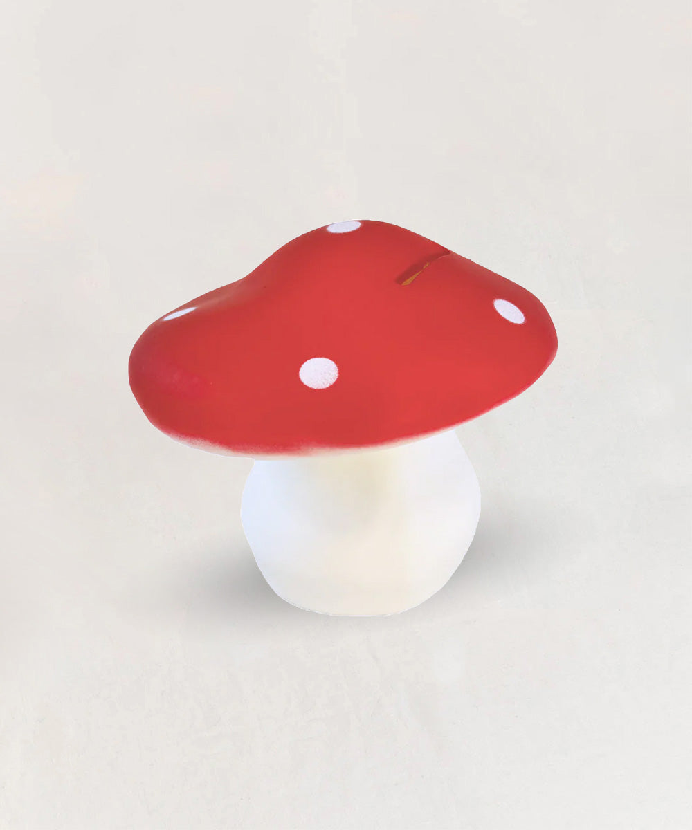 Le Mushroom Bank is a red and white spotted, mushroom-shaped coin bank displayed on a plain light background.