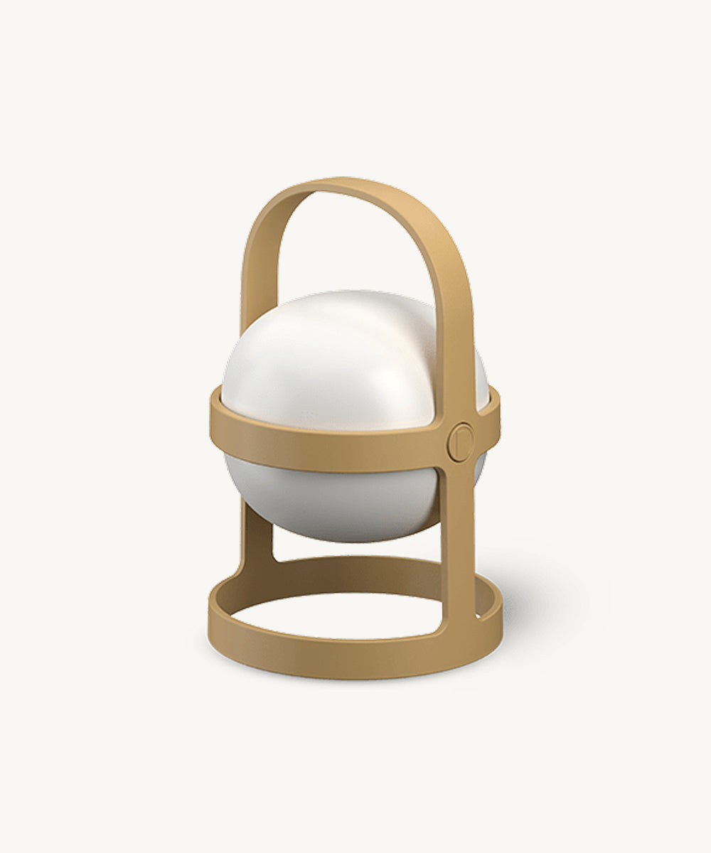 Rosendahl Soft Spot Solar Circular in Wheat: a small, round, white lamp with tan handle and base, modern minimal design shown against a plain background.